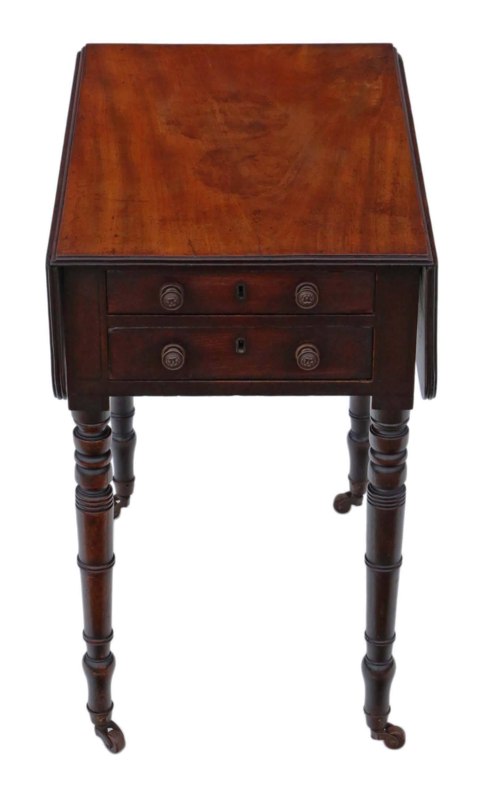 Antique quality Regency circa 1825 mahogany two-drawer drop-leaf work table. Two mahogany lined drawers to one side, which slide freely (dummies to the other).

Solid and strong, with no loose joints. Full of age, character and charm. Attractive
