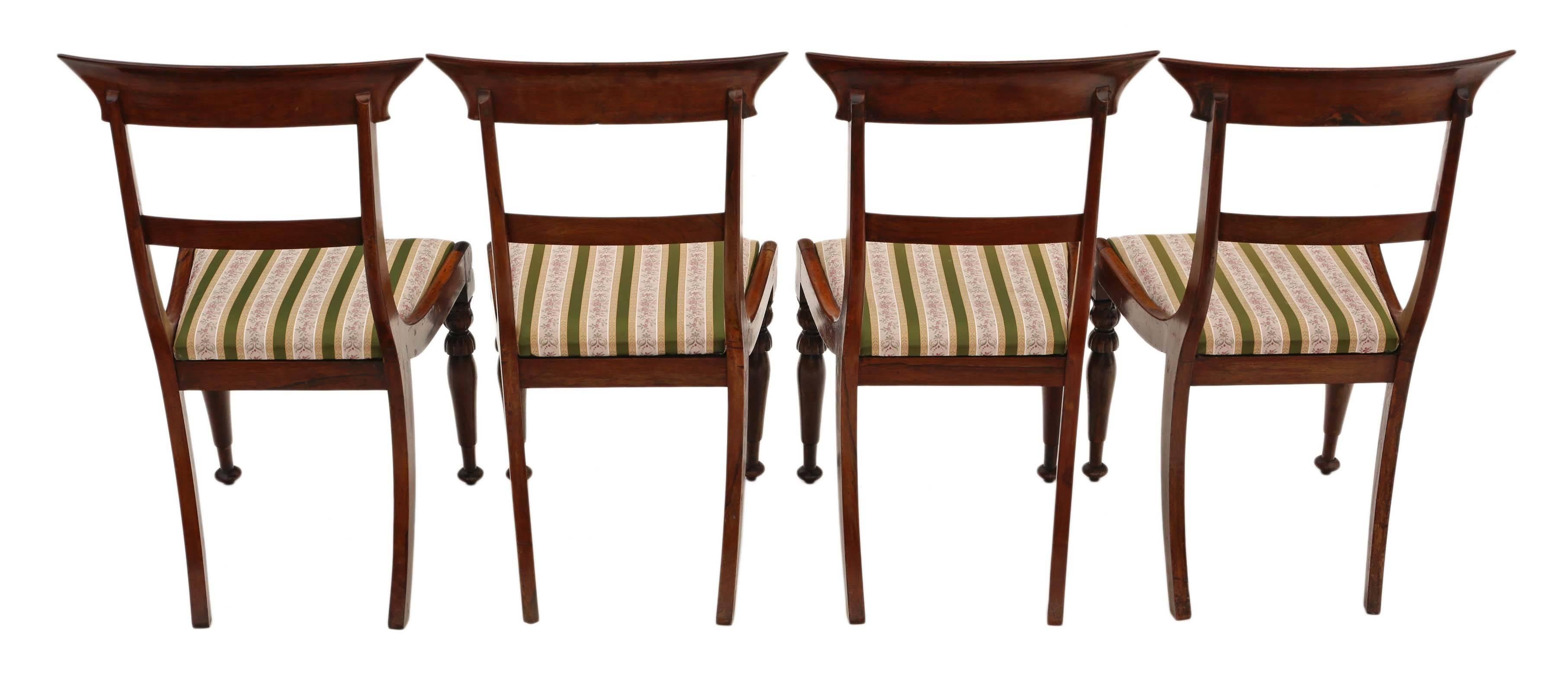 Antique set of four Regency, circa 1825 rosewood dining chairs.

Fantastic age, color and patina. Beautiful front legs and backs.

Solid and strong with no loose joints.

The upholstery is not new, but has only light wear and no major