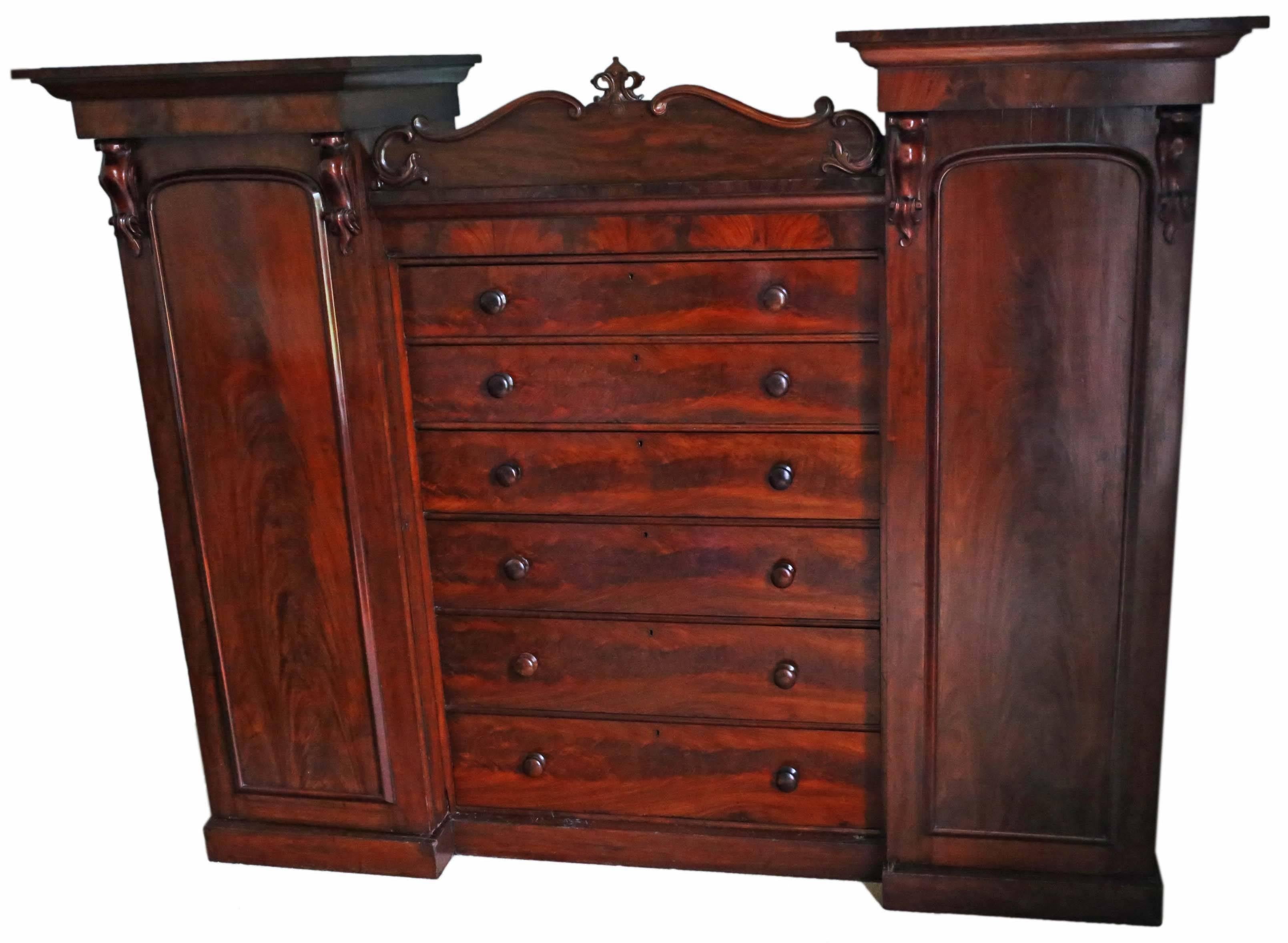 Antique Victorian circa 1860 mahogany compactum wardrobe.

Solid and strong, with no loose joints. Full of age, character and charm. Great matched flame mahogany veneers and patina. Would have been a very expensive piece when made. No