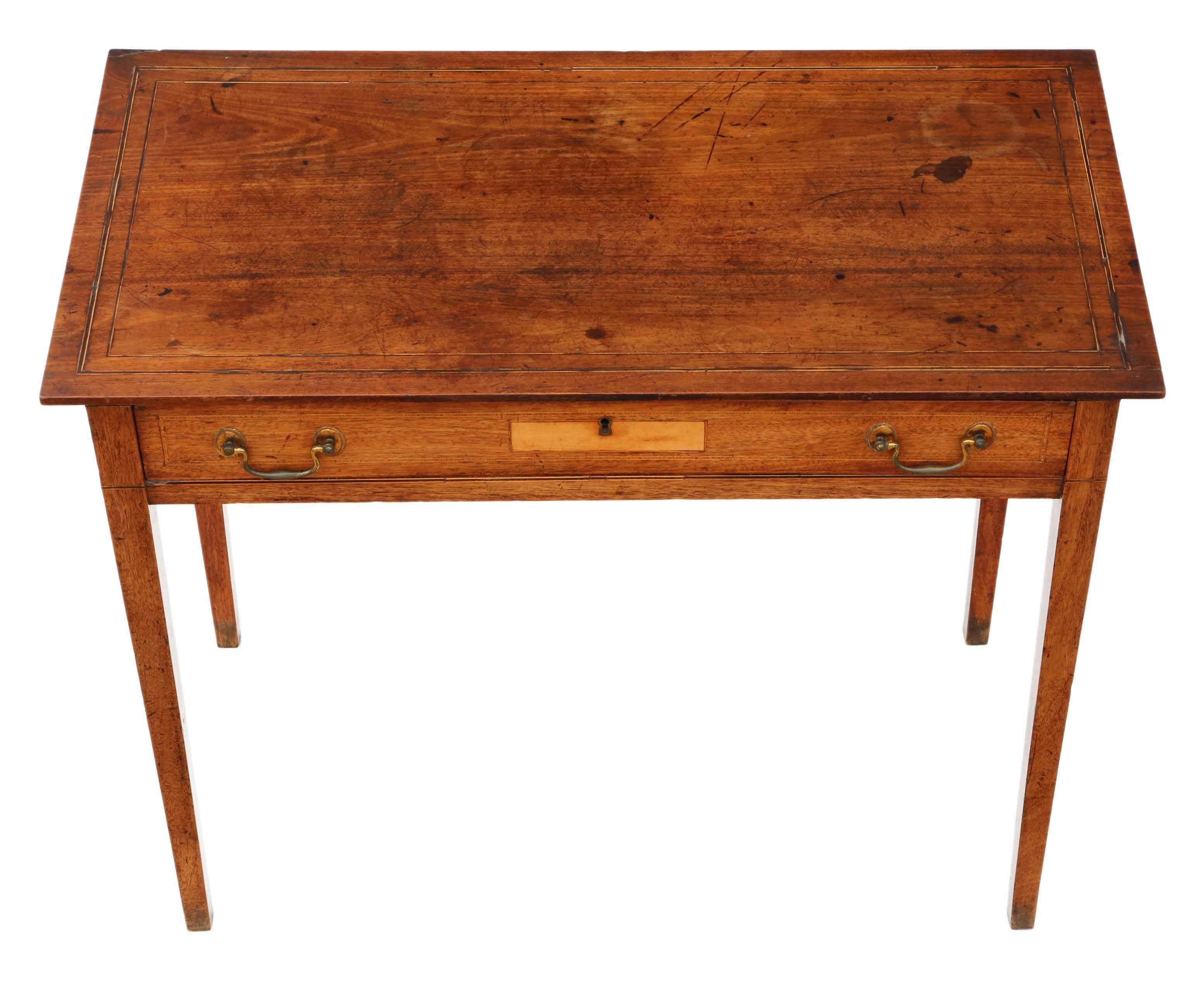 Antique quality Georgian George III circa 1810 inlaid mahogany desk or writing table. Elegant style. Original ormolu handles. A rare find.

No loose joints. Full of age, character and charm. The oak lined drawer slides freely.

Would look great