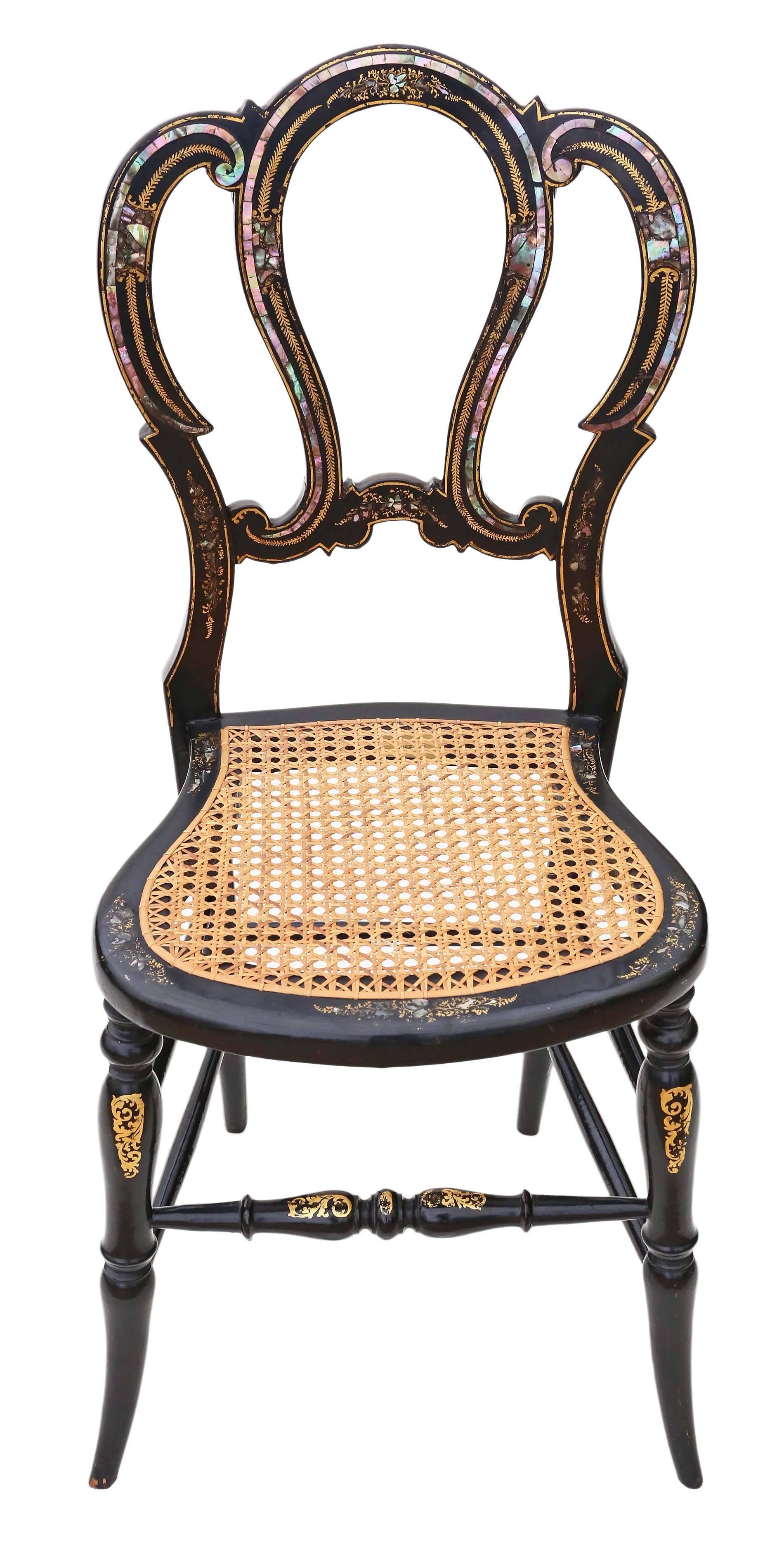 Antique rare Victorian ebonized mother-of-pearl cane inlaid bedroom chair. Came from the Master's Lodge, Trinity College, Cambridge.

Dates from circa 1890. Fantastic quality decorative piece, with amazing inlays and gilt paint