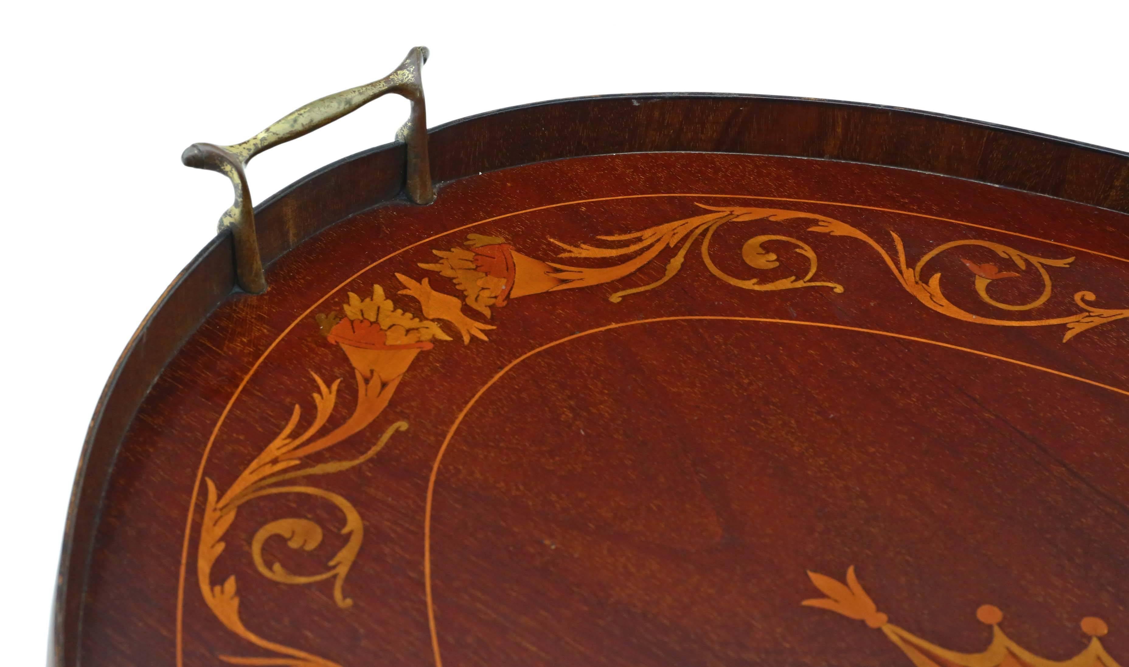 Antique quality Victorian inlaid mahogany oval serving tray tea.
A great quality tray with a wooden gallery and ormolu brass handles, one of the best examples that we have seen.

Very attractive, with lovely proportions and styling.

Desirable