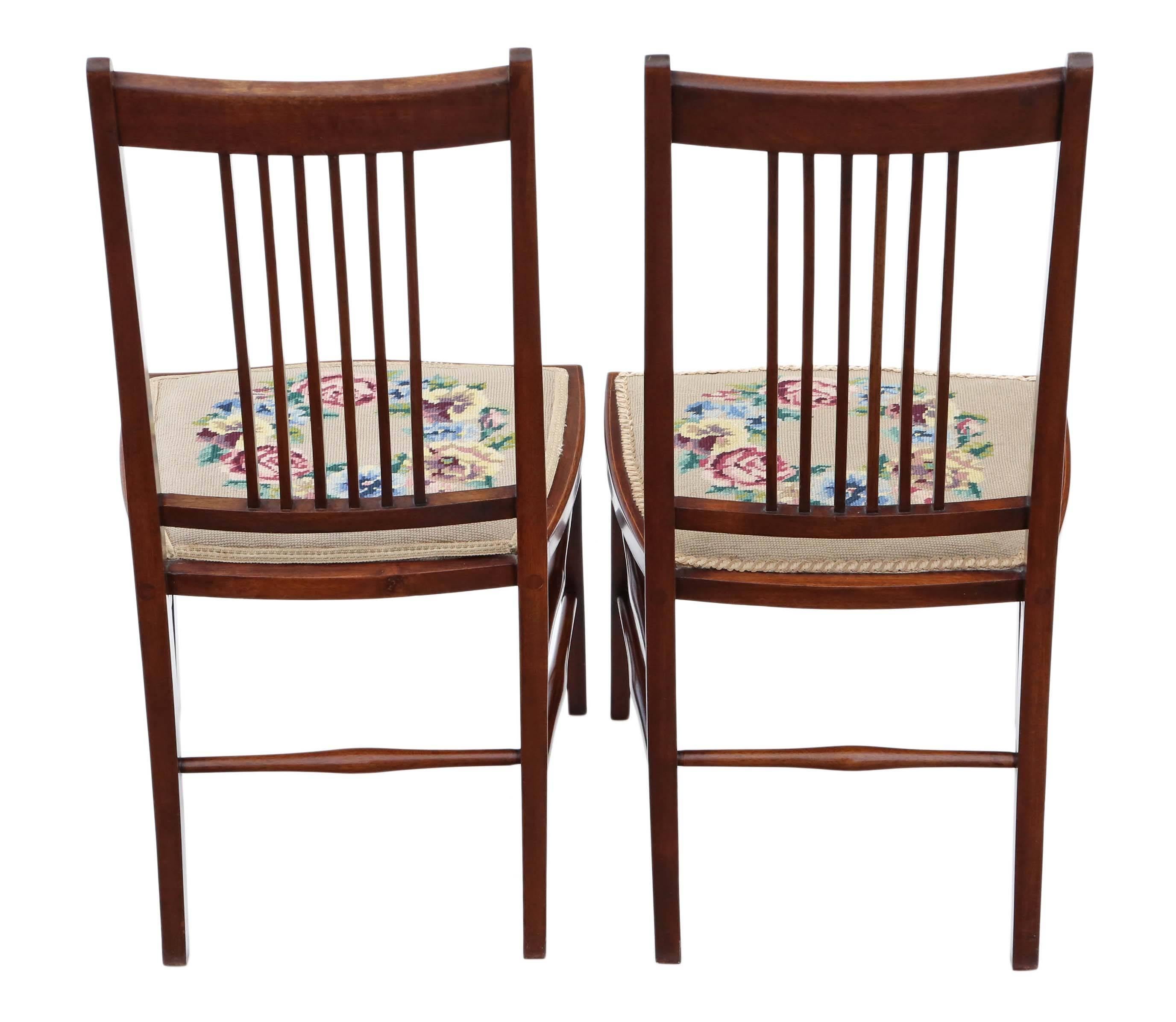 Antique quality pair of Edwardian needlepoint inlaid mahogany bedroom chairs.

A great rare find, with lovely proportions and styling.

Lovely color, age, patina and charm.

The needlepoint seat upholstery is old, but only has light wear and
