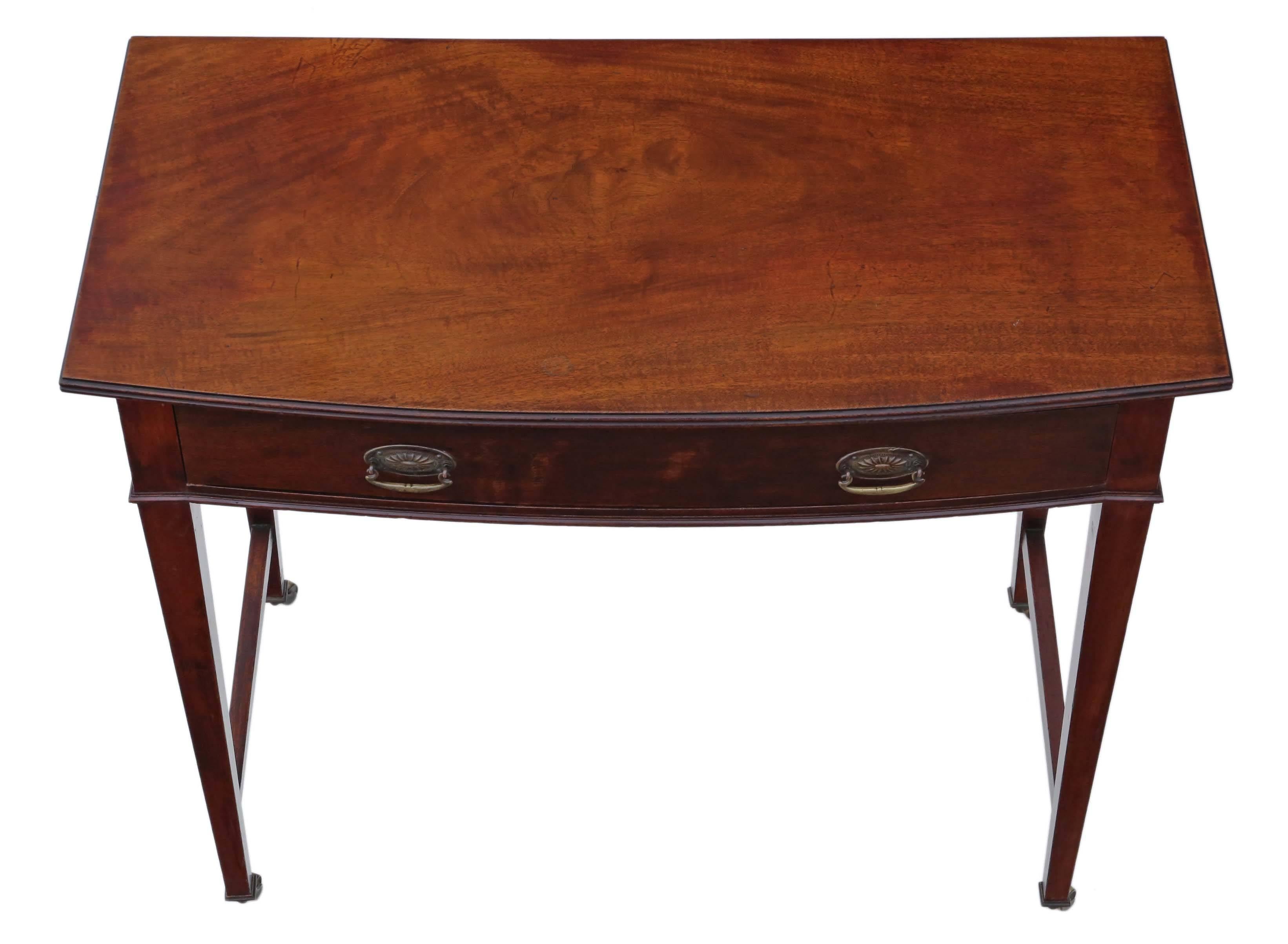 Antique Victorian, circa 1900 bow front mahogany writing table desk dressing.

Fabulous shape, proportions, color, age and patina. No woodworm.

The table is solid, with no loose joints and the mahogany lined drawer slides freely. Period brass