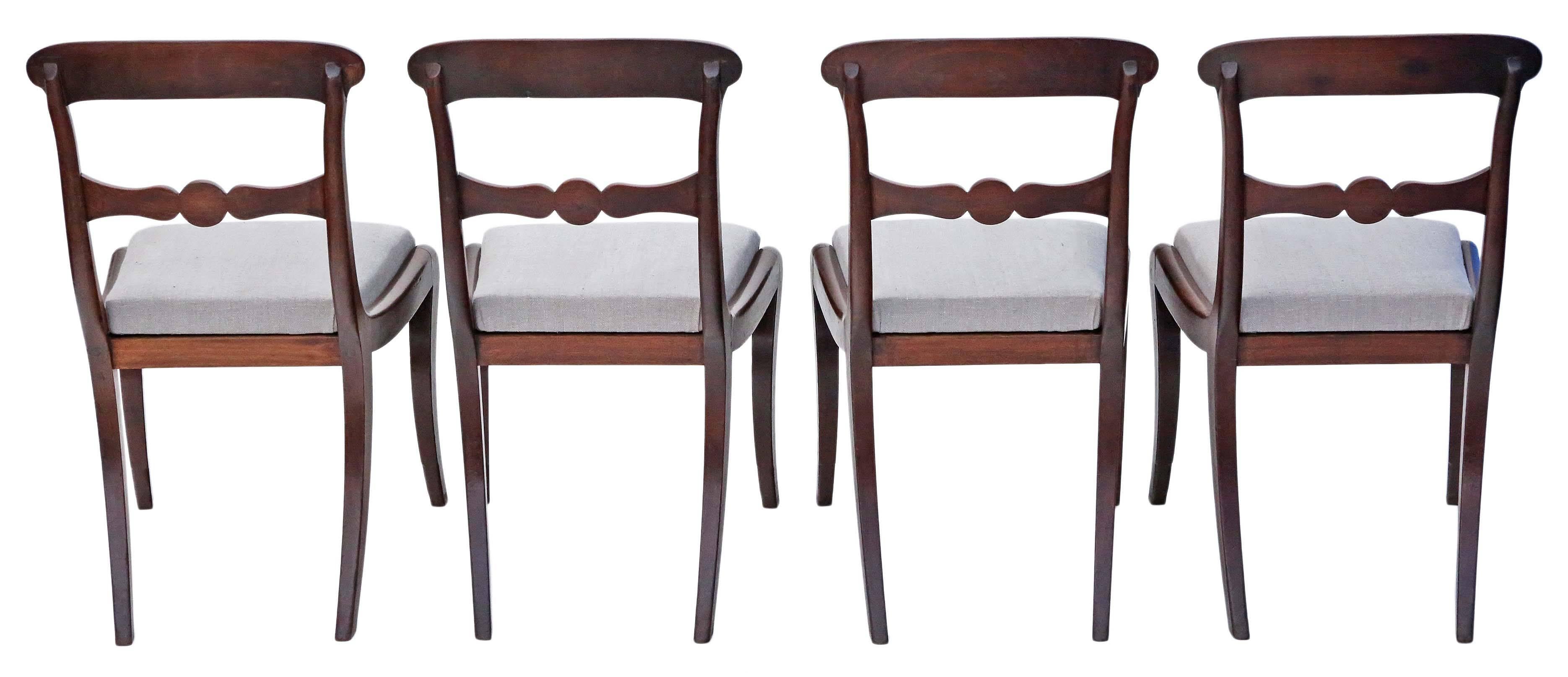 Antique rare set of four mahogany Georgian Regency dining chairs.

Date from circa 1800-1830. Fantastic age, color and patina. Great sabre legs and simple carving to the backs.

Solid and strong with no loose joints.

Good new reupholstery job