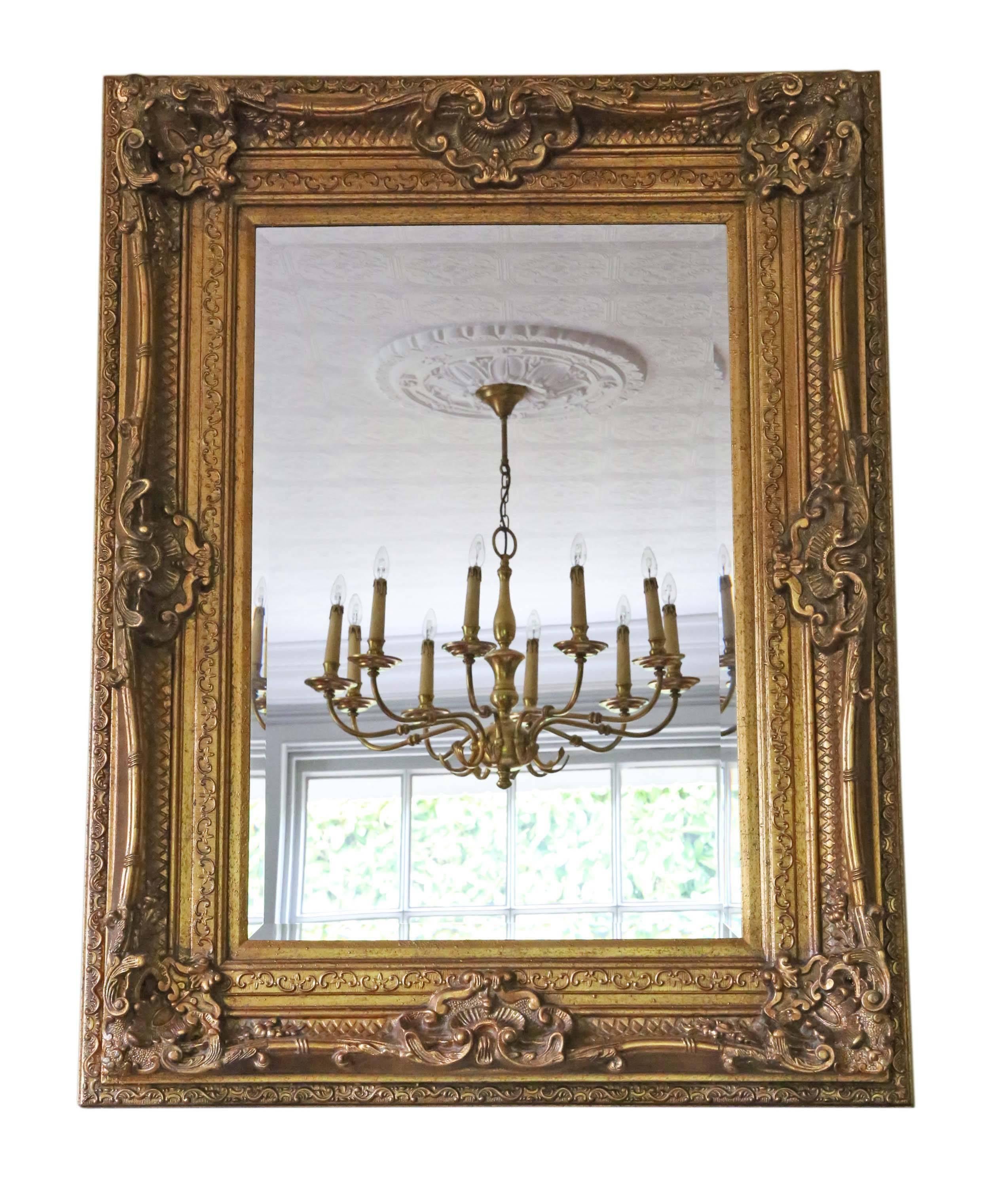 Antique large quality Victorian style reproduction gilt wall mirror.

This is a lovely large impressive mirror. Could be hung in portrait or landscape.

Would look amazing in the right location quite charming.

The frame and bevel edge