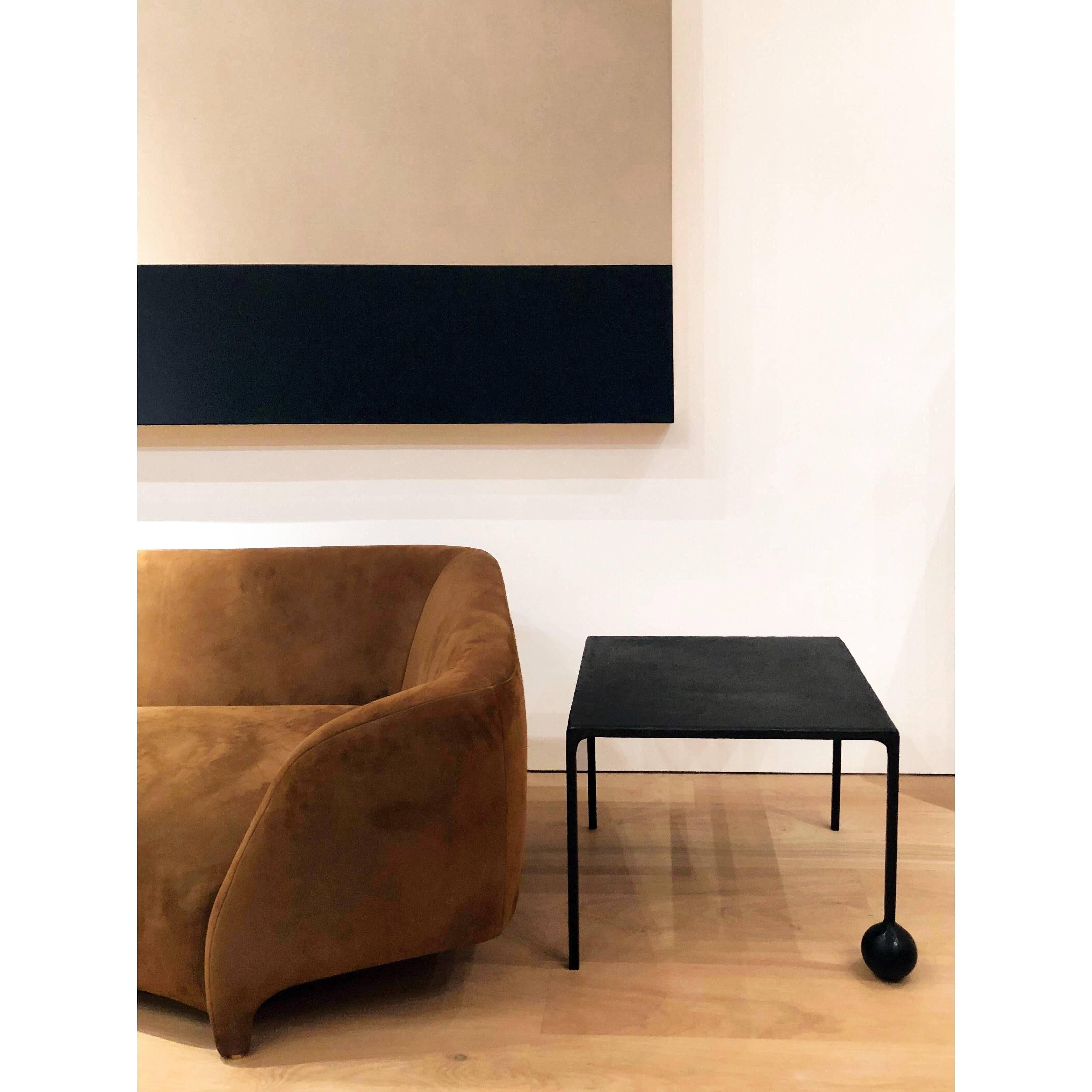 TABLE NO. 2 - SQUARE 
J.M. Szymanski
d. 2017

This geometric, solid, steel structure is supported by a cast-sphere base. The refined simplicity of this design speaks volumes, and adds depth and elegance to any space. 

Custom sizes available. Made