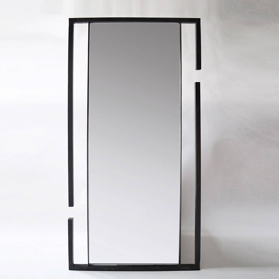 Wall mirror
Blackened and waxed steel, ultra clear mirror
J.M. Szymanski
d. 2017

Inspired by two repelling magnets, this mirror is unique in its form and structure. Made from blackened and waxed steel by J.M. Szymanski. This mirror can be