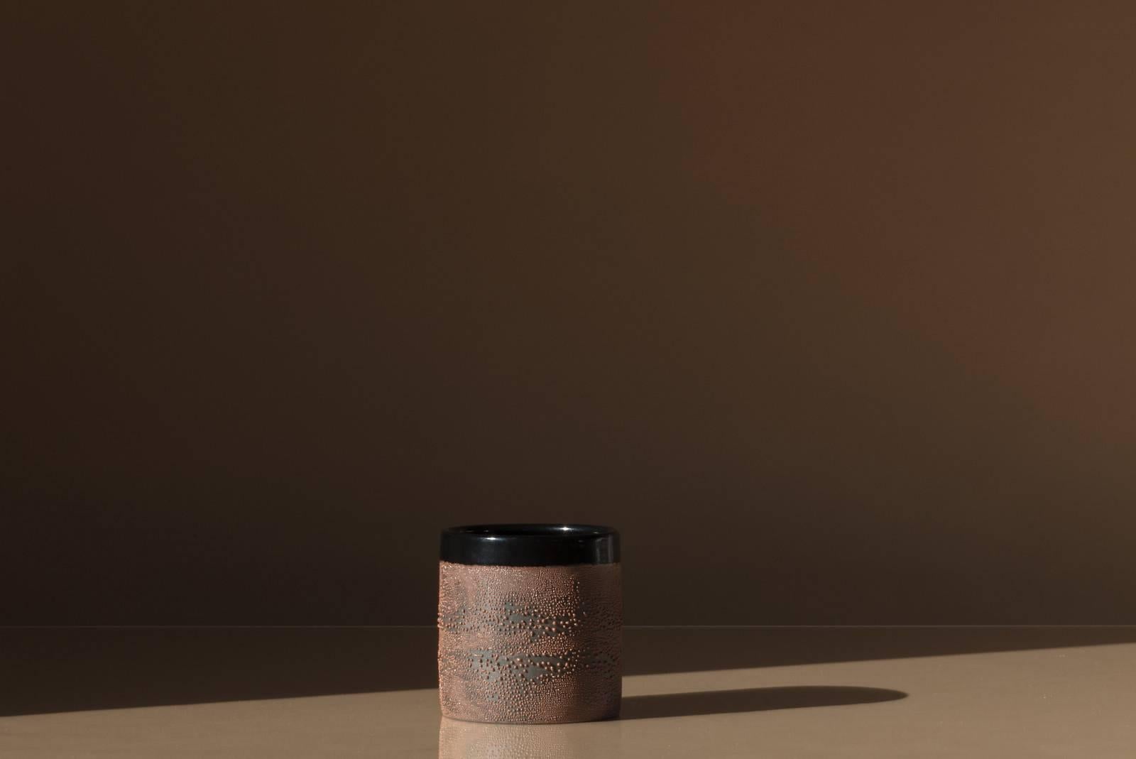Handmade stoneware cup. Glossy black interior and rim with textured brown dew glaze body. Also available in black and white. Handmade by Malka Dina in Brooklyn, NY.
Due to the handmade nature of this item, each piece will be slightly unique and