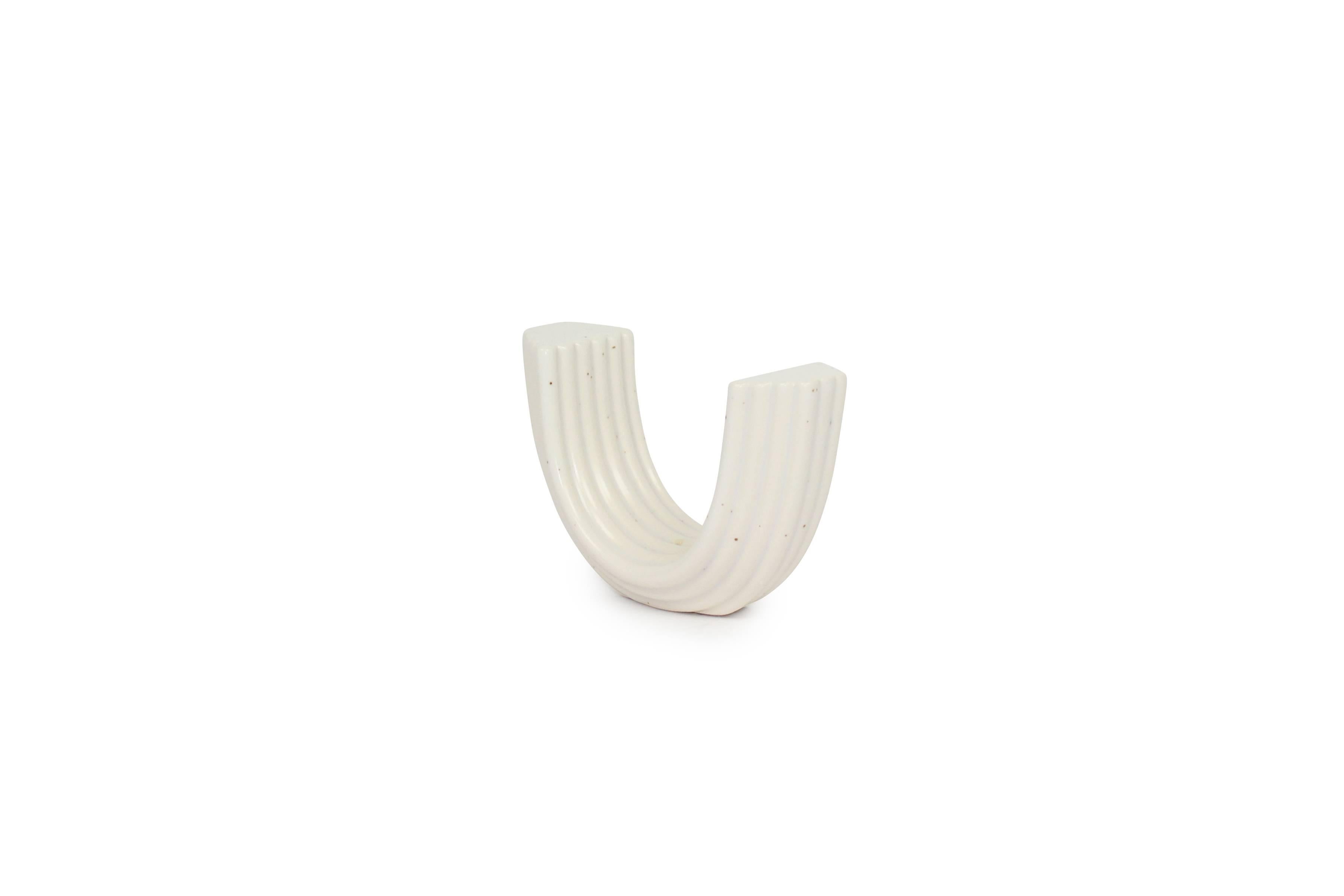 Coiled arch shape handmade ceramic incense holder.  It's minimalist yet unique design is a functional shelf or table accent for any room.  Available in additional colors.
Due to the handmade nature of this item, each piece will be slightly unique