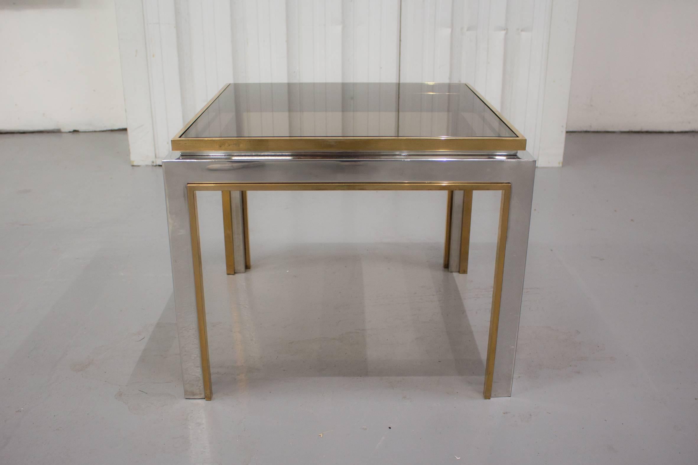 This elegant Maison Charles 1970s brass and chrome side table is signed 