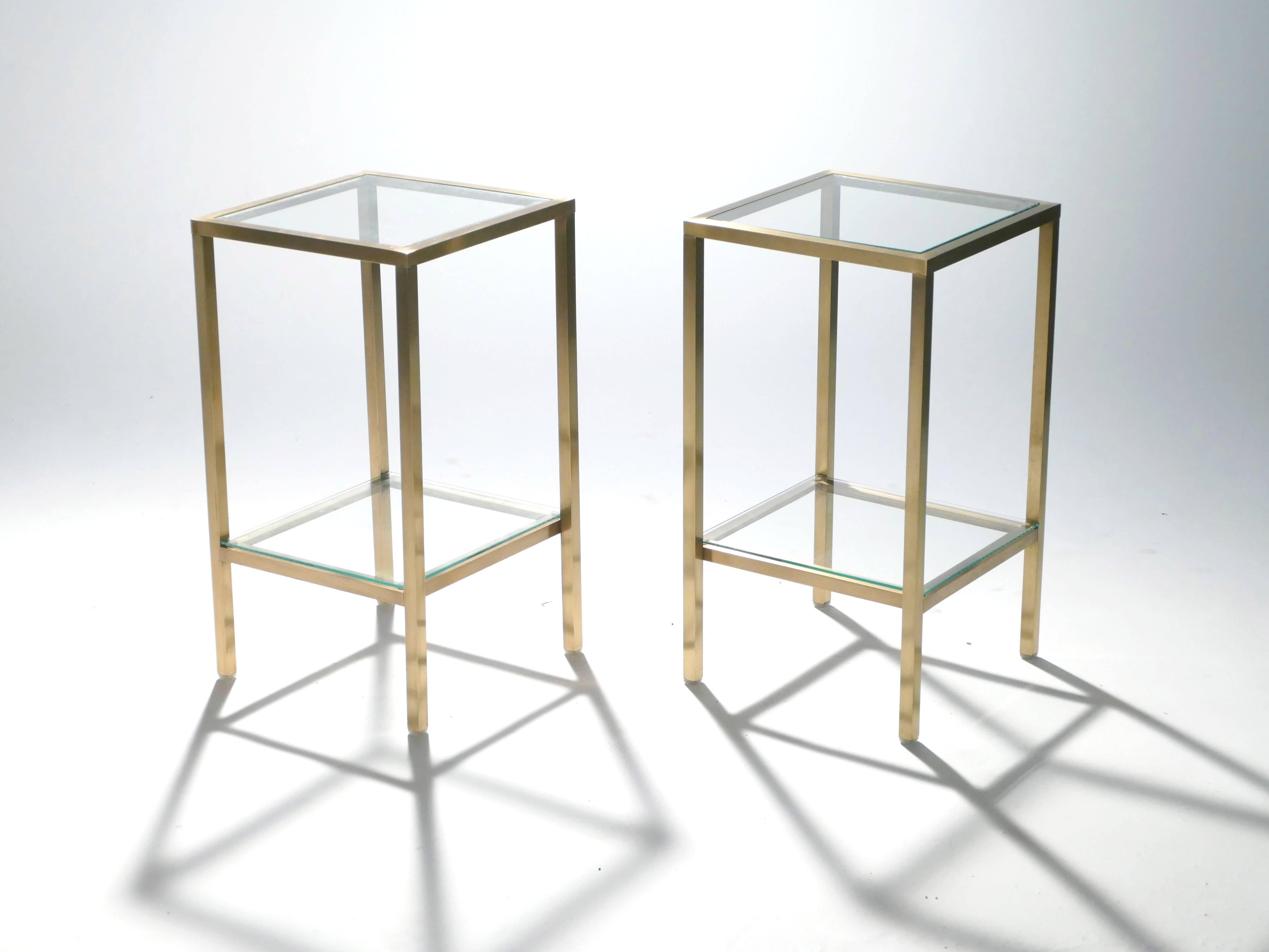 These versatile and Classic tables work equally well as bedside tables or living room side tables. Their sleek design is highlighted through strong brass feet and a transparent glass top, making them a perfect choice to incorporate midcentury