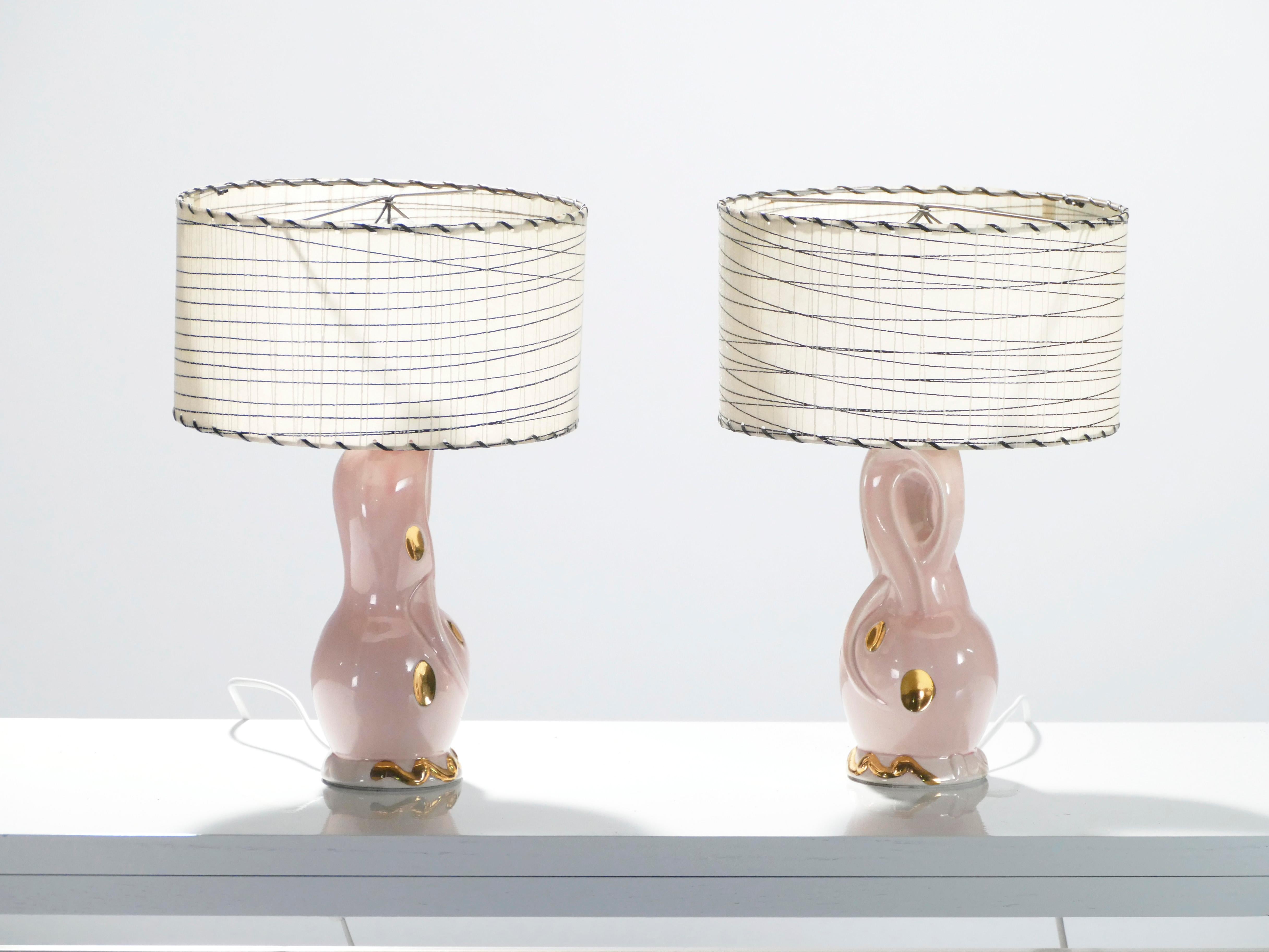 You’ll be delighted by the unexpected pops of glamour twisted into the design of these French bedside lamps. Made from light pink ceramic and with molten golden details, the pair comes with matching lampshades to help cast a cozy glow around your
