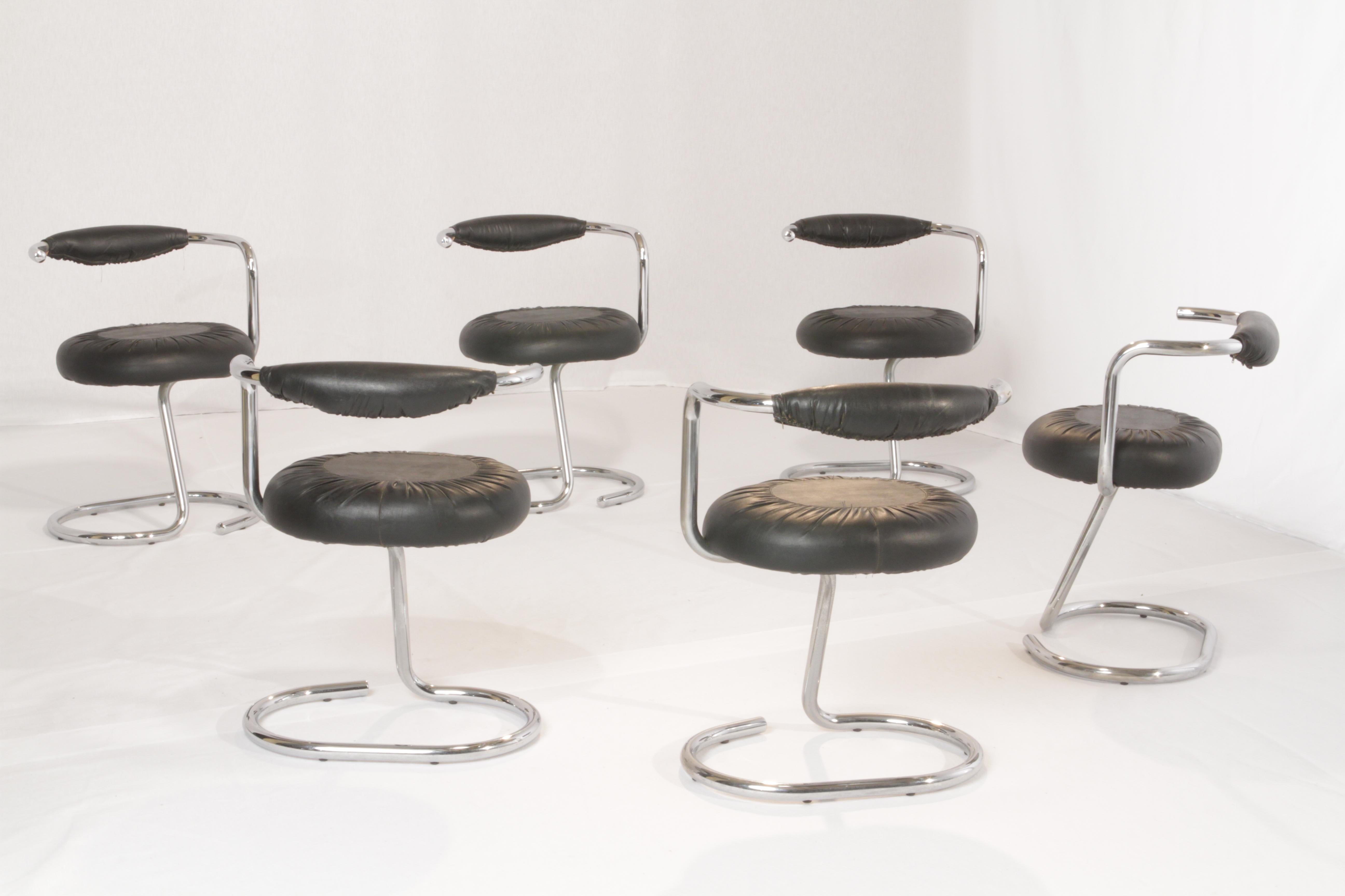 Lend a touch of contemporary appeal to your dining room with this lovely set of six “Cobra” chairs by Giotto Stoppino. These iconic Mid-Century Modern Italian pieces in chrome and black leatherette features a subtle and architectural look. They are