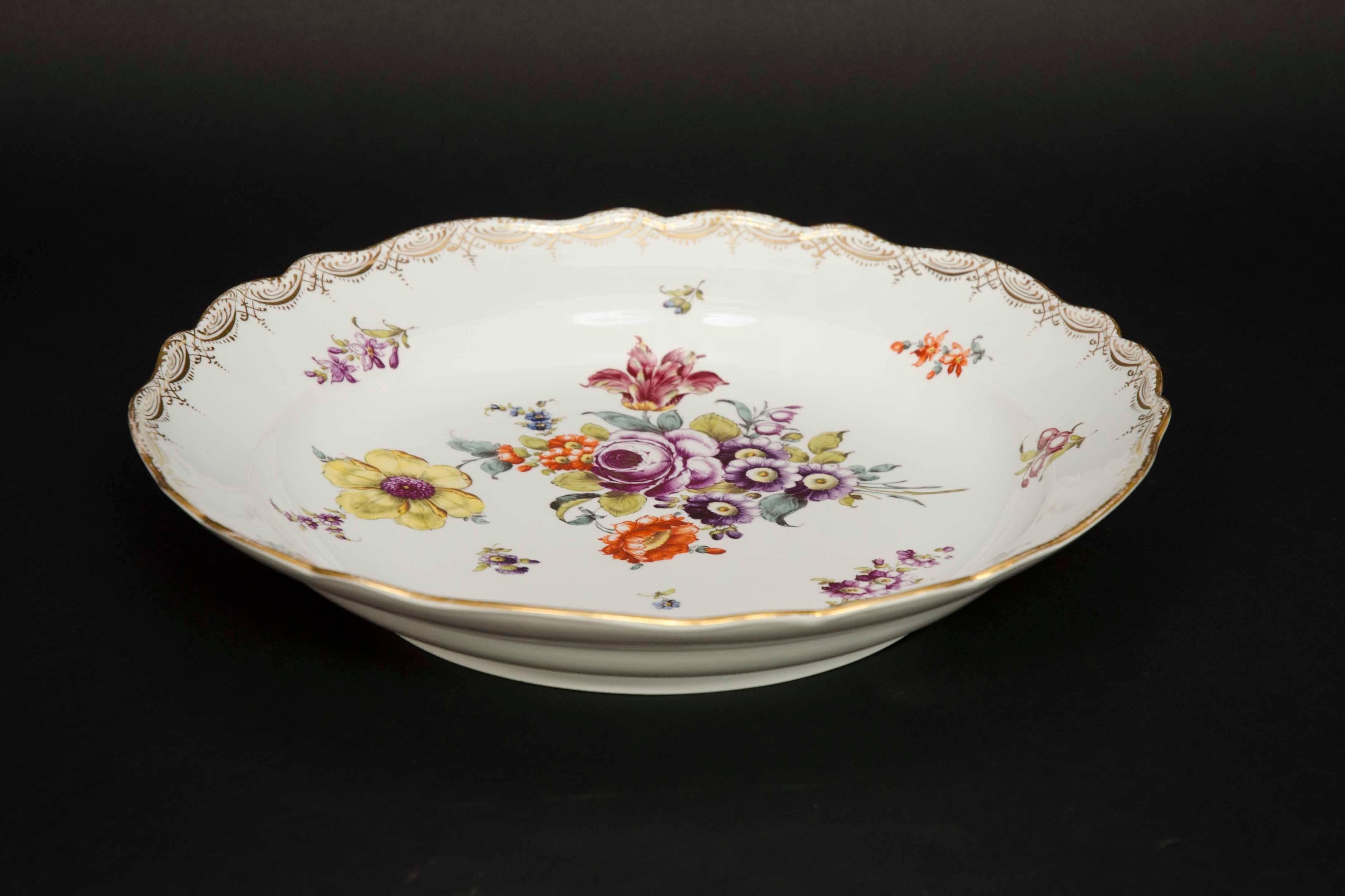 Large decorative plate with painted flowers and gilt decorations. Vivid colors. Great condition. Marked on the back. Very decorative especially as wall decoration. 
Size: diameter of 39cm. 
Meissen, mid-19th century.