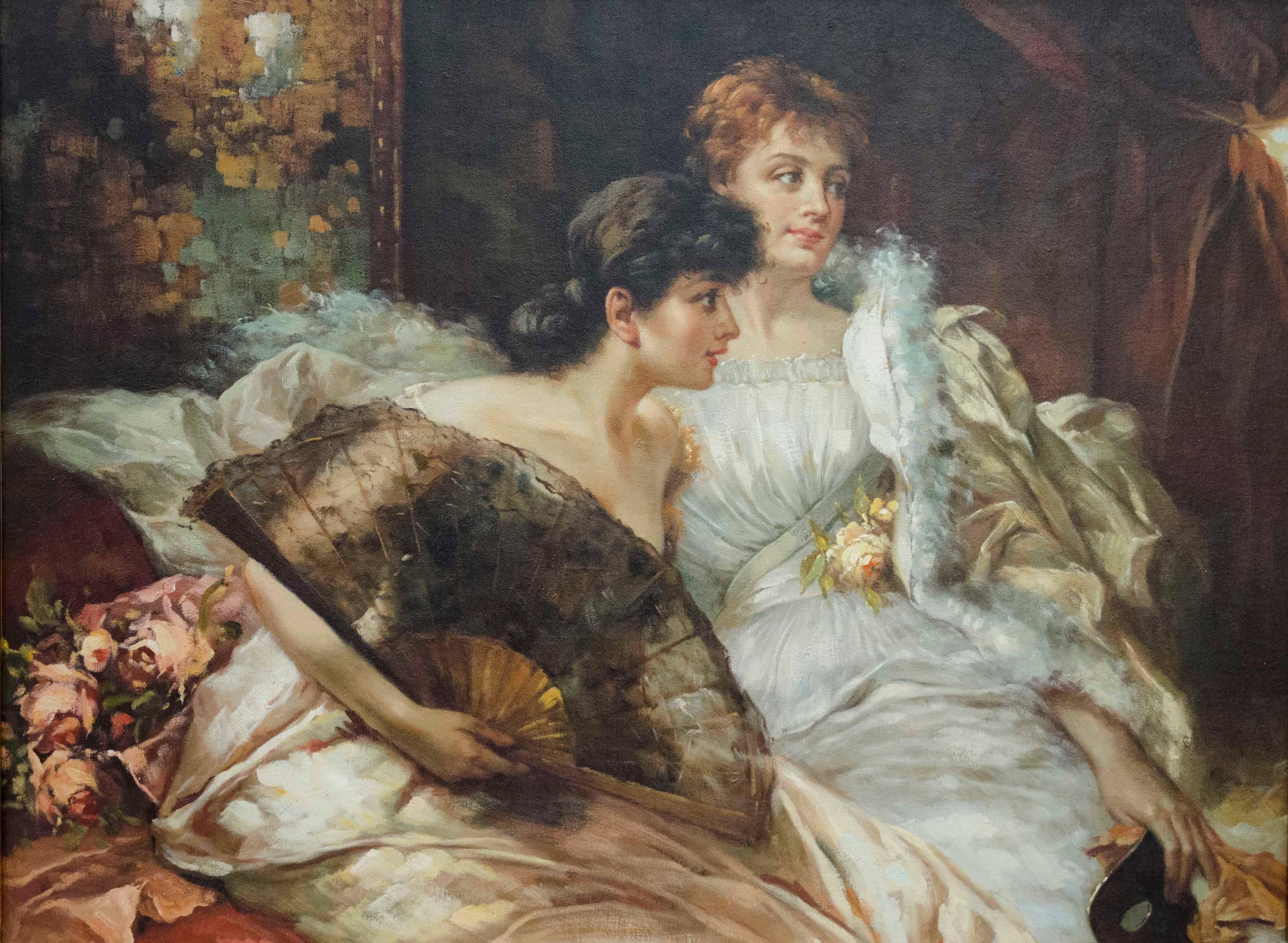 Lovely scene of a pair of well dressed ladies sitting and chatting at what seems to be a masked ball. The lady with brown hair is leaning forward giving the impression to talk to someone outside of the composition. She has nude shoulders and covers
