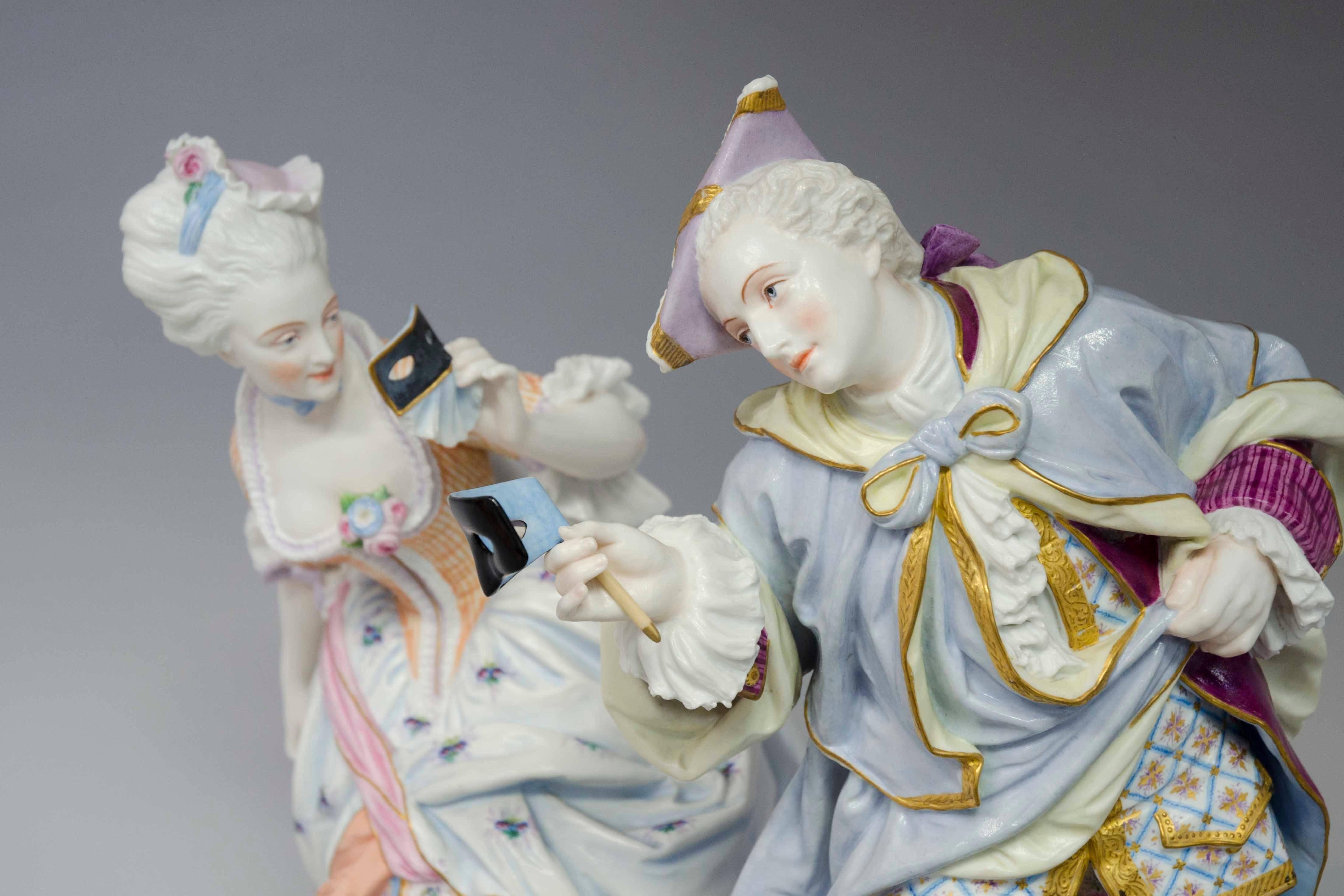 A pair of large bisque 18th century court figures at a masked ball. Both are elegantly bowing and making amorous gestures. The base is also decorated. Inspired by the traditional Venice carnaval. Second part of the 19th century, raised blue pad with