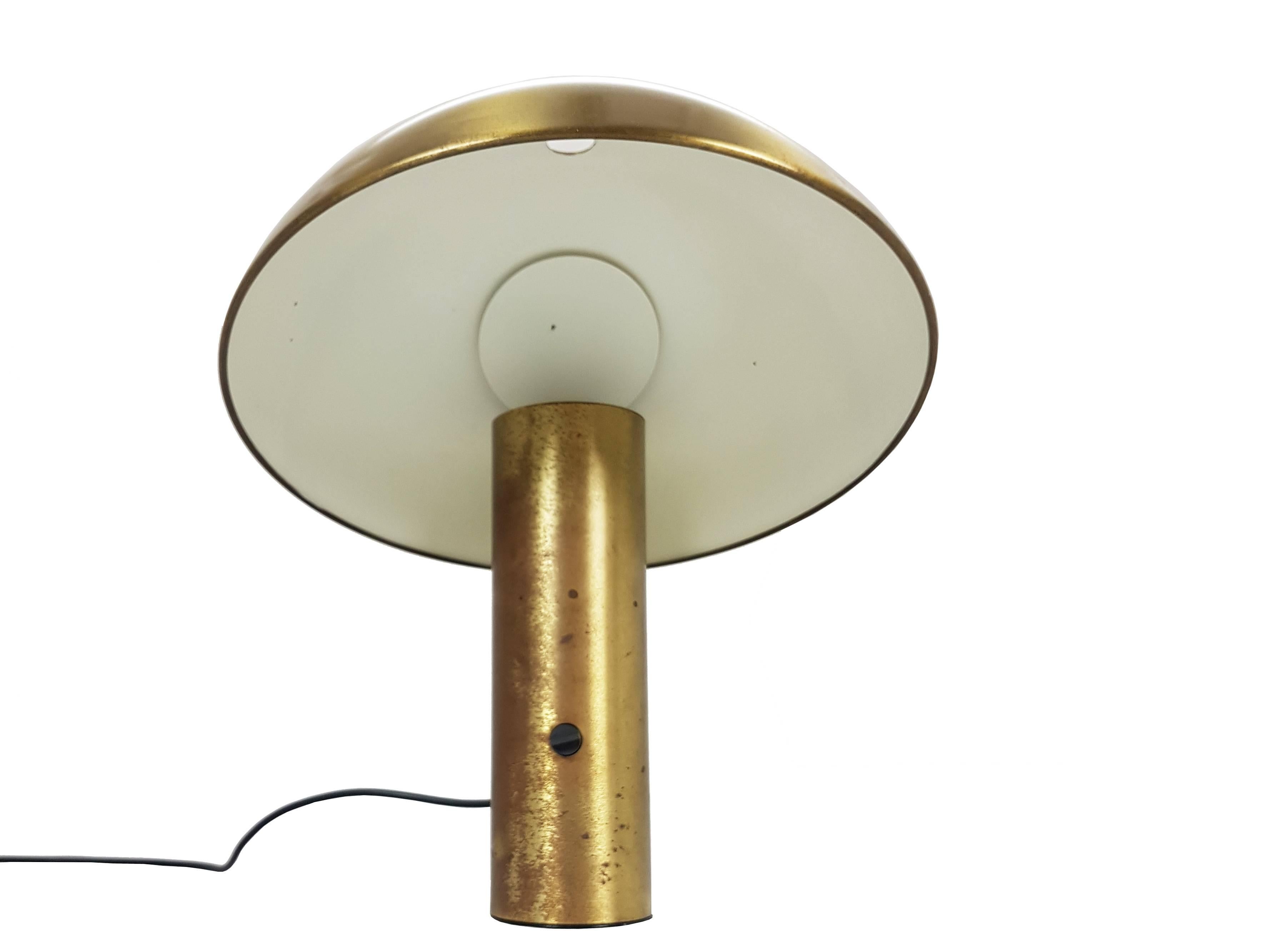 This table lamp was designed by Franco Mirenzi for Valenti in 1978. It is made from mat brass and metal and it features a dimmable electrical system. Fair vintage condition: Signs of wear and oxidation patina consistent with age and use. See
