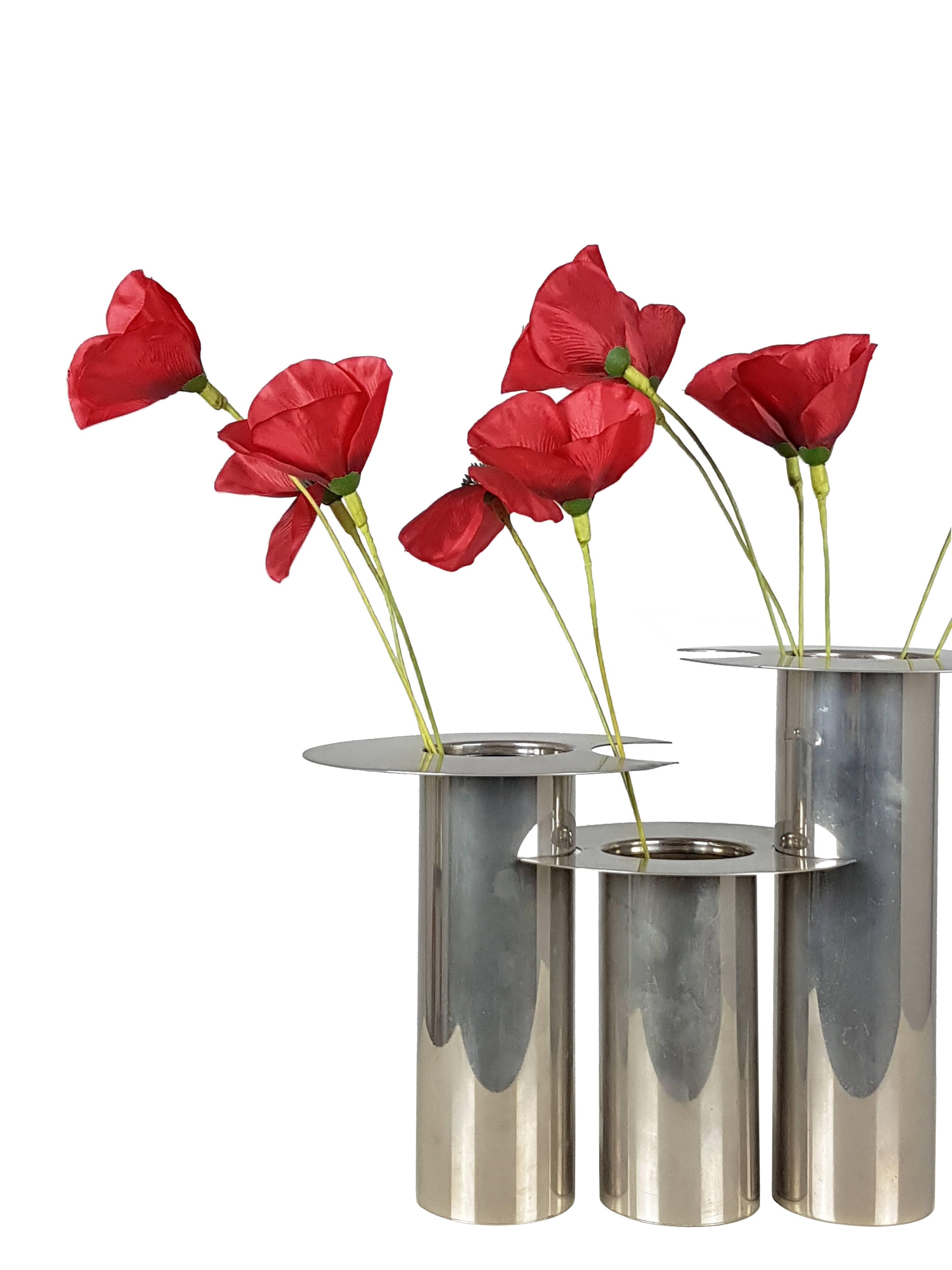 This elegant set of three vases was designed and produced in Italy, circa 1970s. They are made from nickel-plated metal and they can be used separately or combined. The set remains in excellent vintage condition.