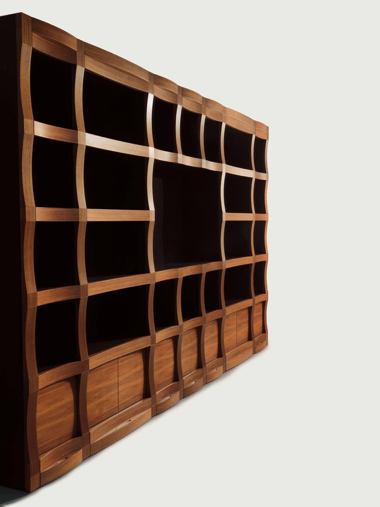 Wooden modular bookcase in black American walnut, natural finish, matt lacquered finish for open spaces and inside.
Wave detail on front side, touch latch doors and soft closing system drawers.
Module cm. 40 x 40
Module cm. 80 x 40.
 