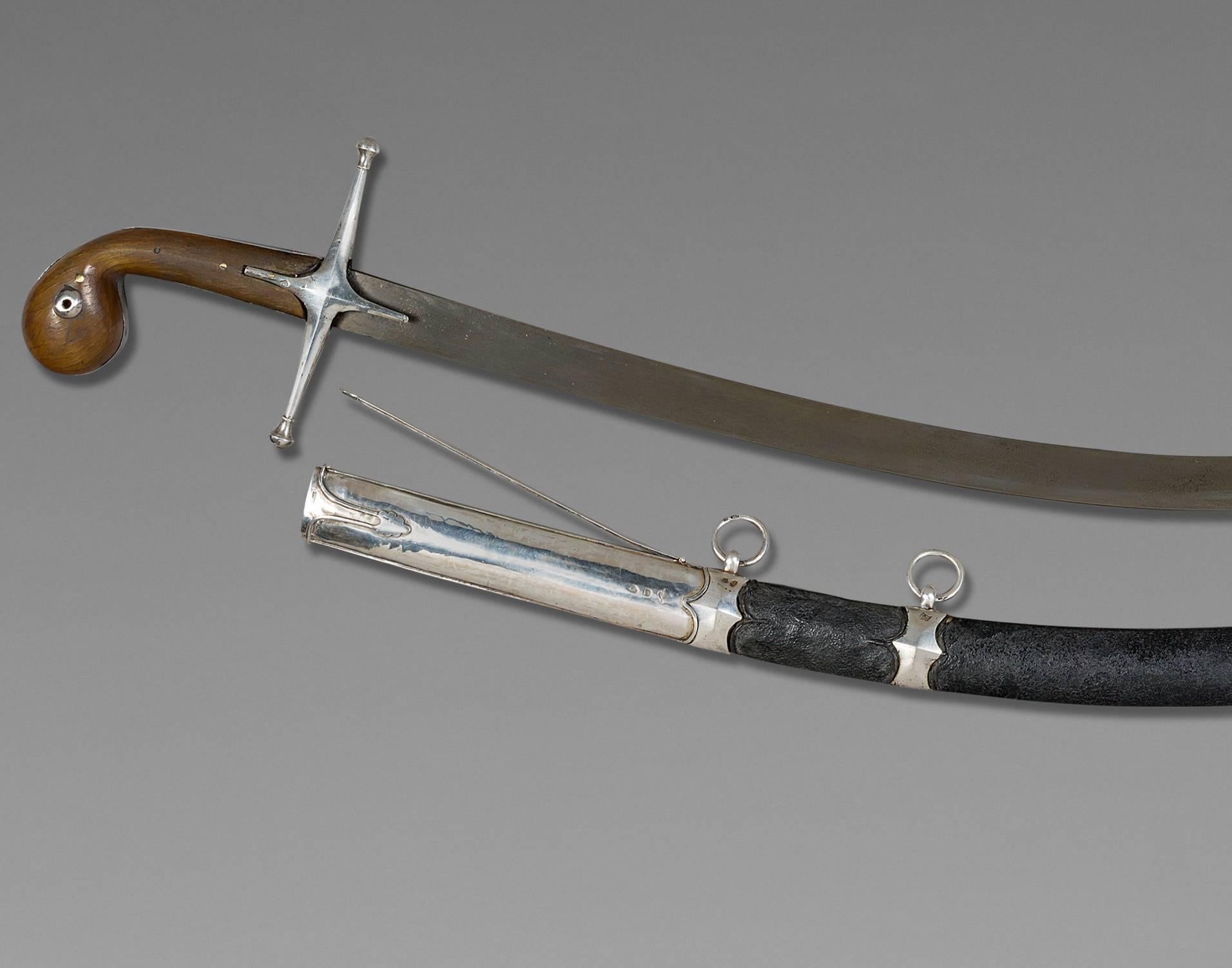 Oriental saber, also called Shamshir
Ottoman Empire, late 18th century 

Handle in horn, silver mounted, Damascus blade, scabbard garnished of black leather.

Dimensions
Whole saber: 42