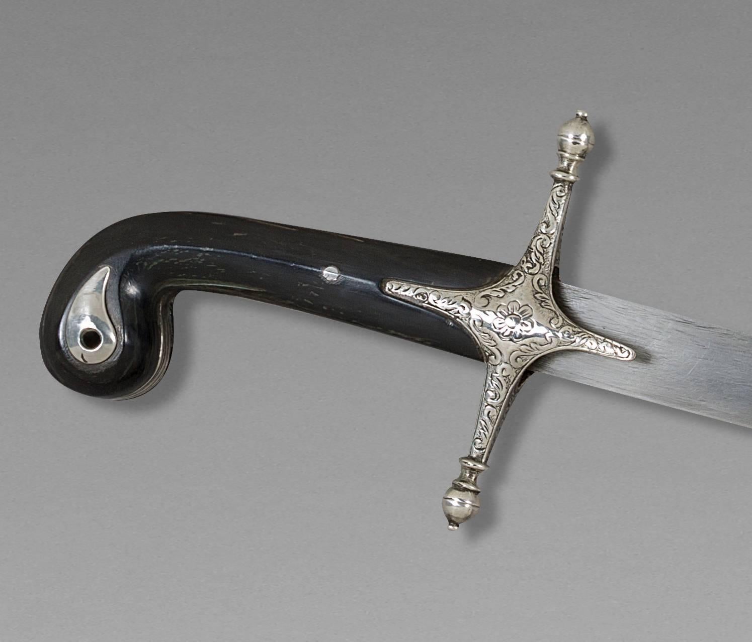 Oriental saber, also called Shamshir
Ottoman Empire 
late 18th century

Handle in horn, silver mounted, Damascus blade, scabbard garnished of black leather.

Measure: Whole saber 39 1/2