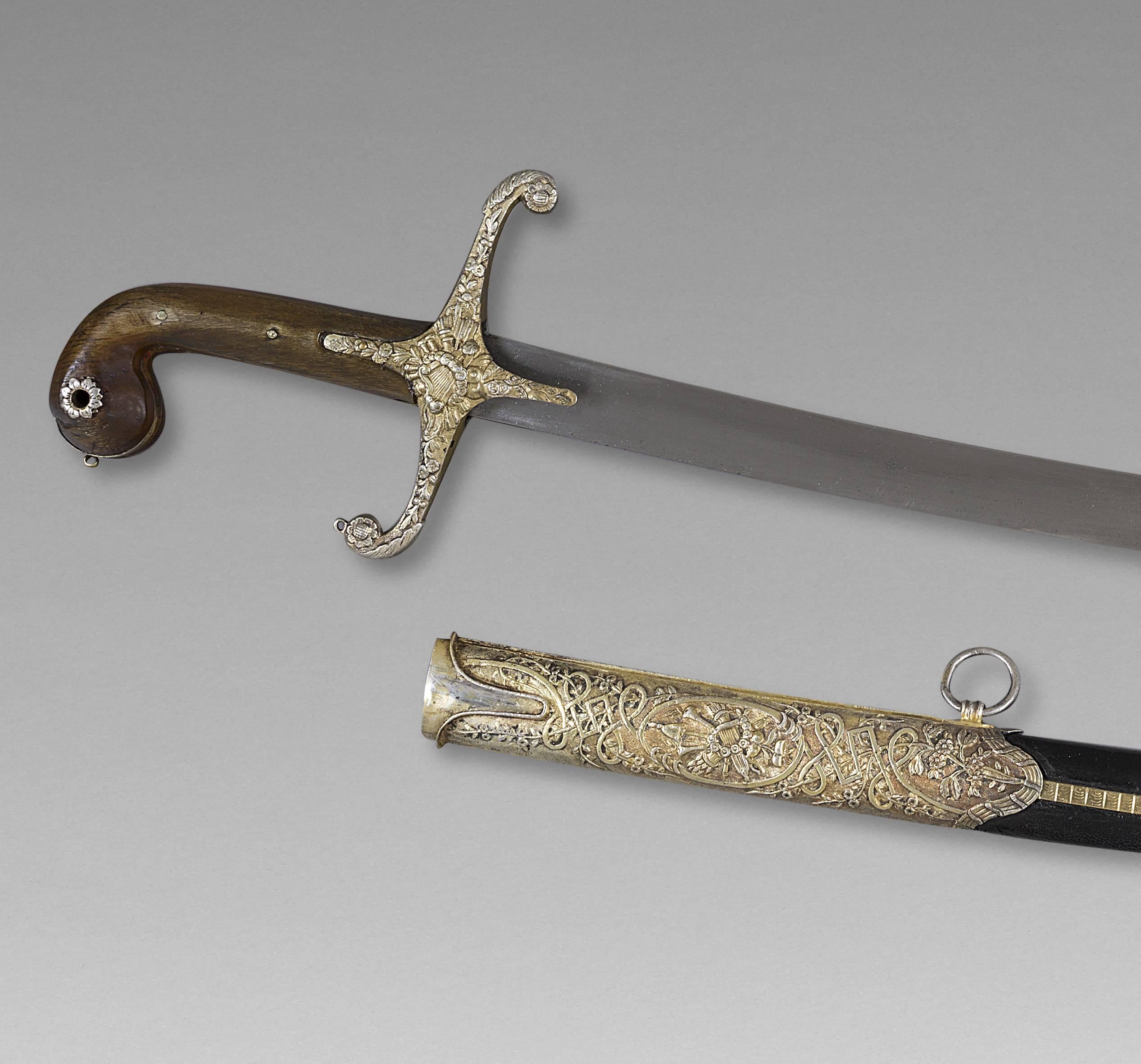 Oriental saber, also called Killich
Ottoman Empire, late 18th century

Handle in horn, silver mounted, Damascus blade, scabbard garnished of black leather.

Measure: Whole saber 40