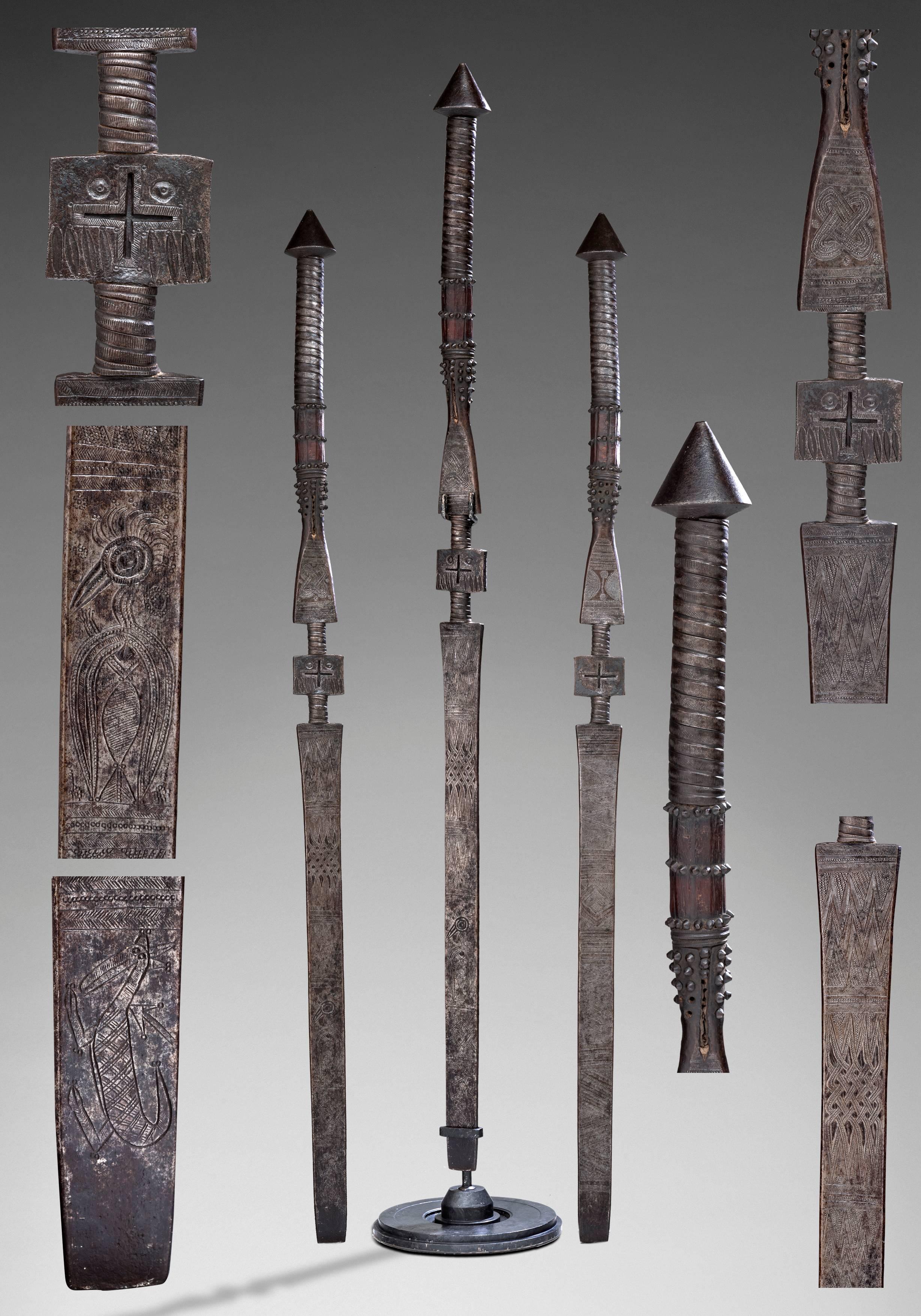 Cult saber, Yoruba symbol 
circa 1860
Nigeria 

Wrought iron with delicate sculptures

A similar sword is in a French Museum in Paris, Musée du Quai Branly
It's a donation from Barbier-Muller of Geneva

Measure: 63