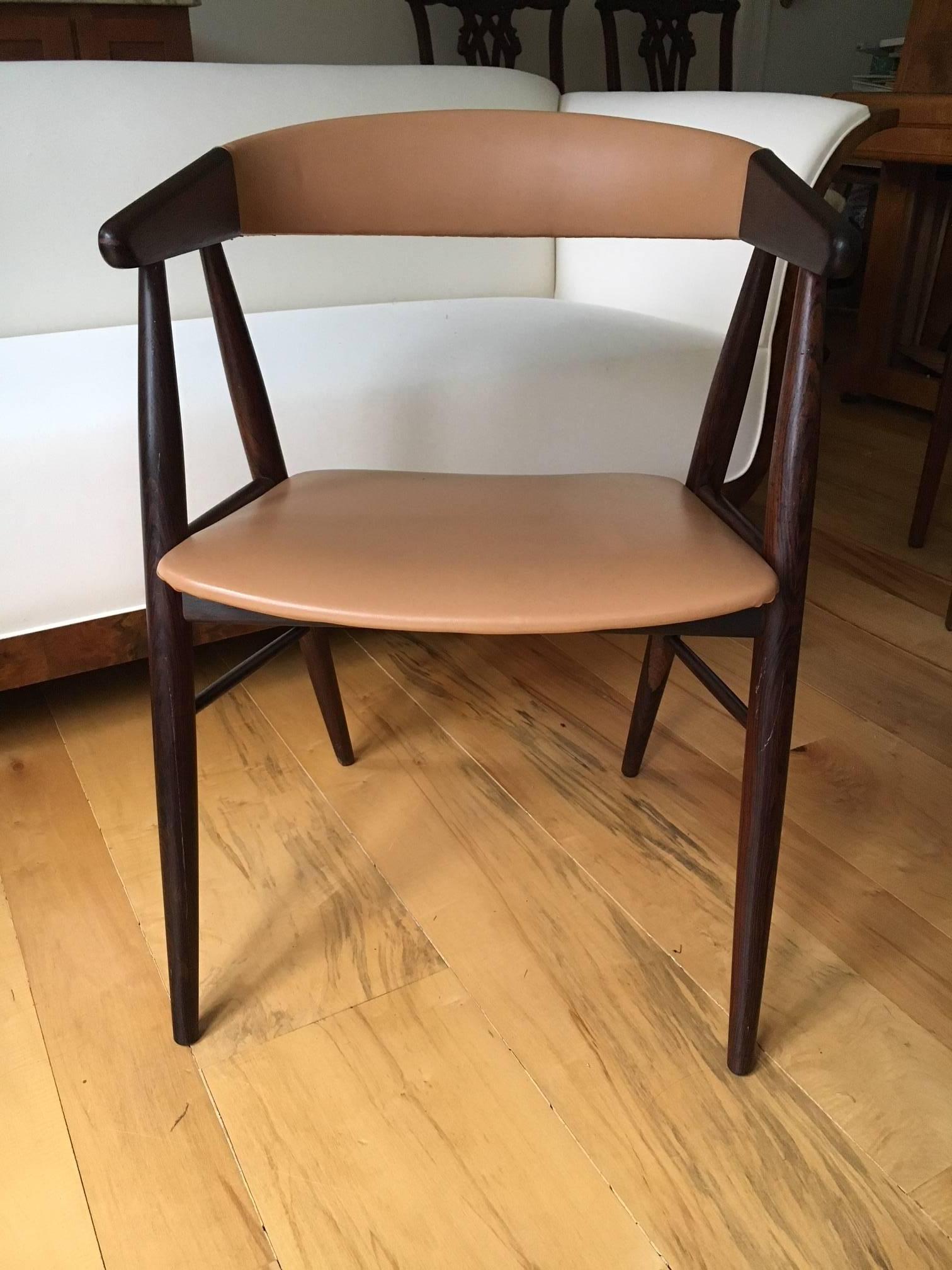 Fabulous Danish Modern desk chair, of rosewood, with a light camel shade of leather on the seat and back. A Classic example of Danish design, combining elegant form and incredible comfort and support while seated.