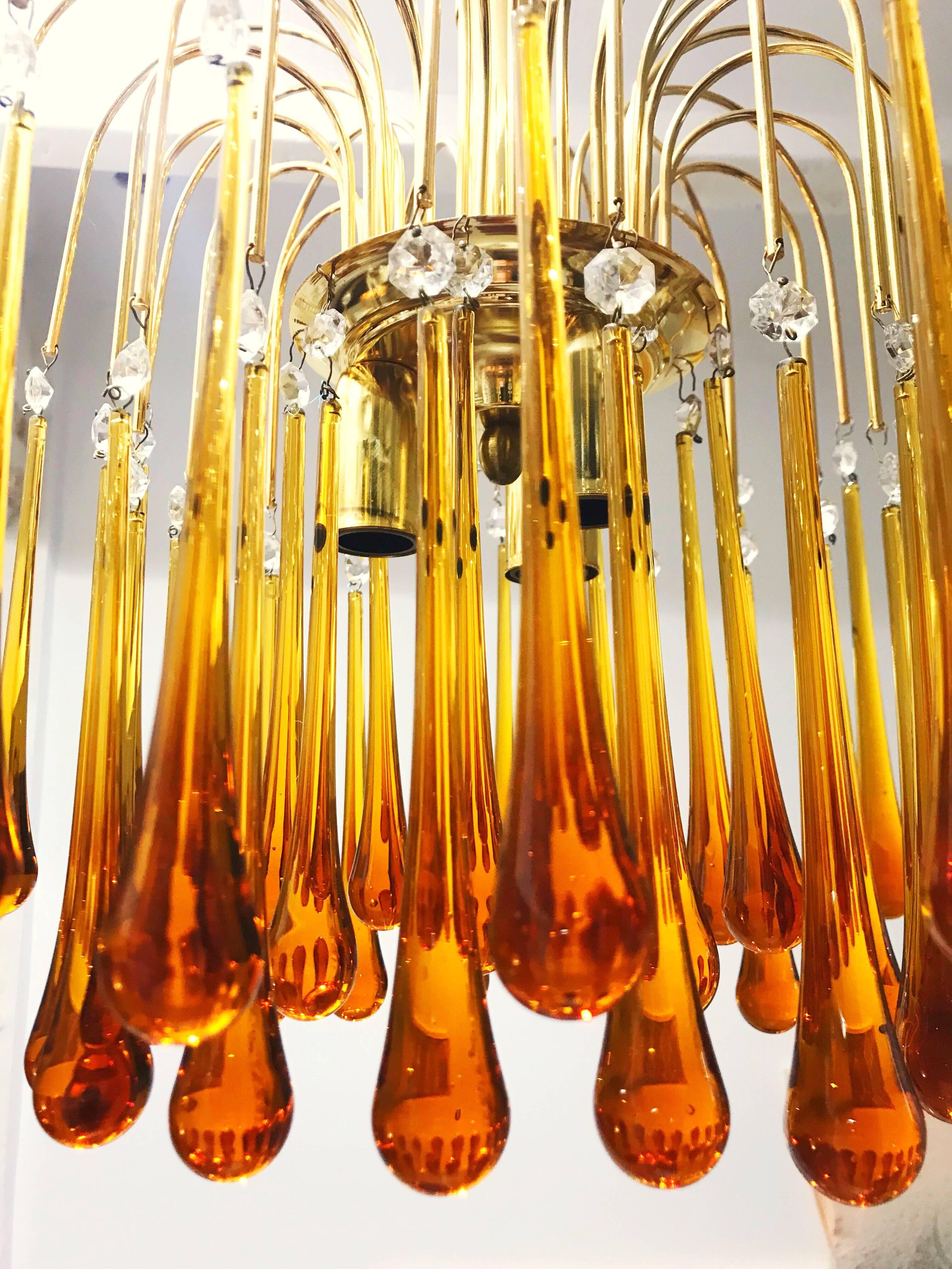 Chandelier with incredible orange crystal drops by Venini, 1960. Gold tone frame with three-light sockets.