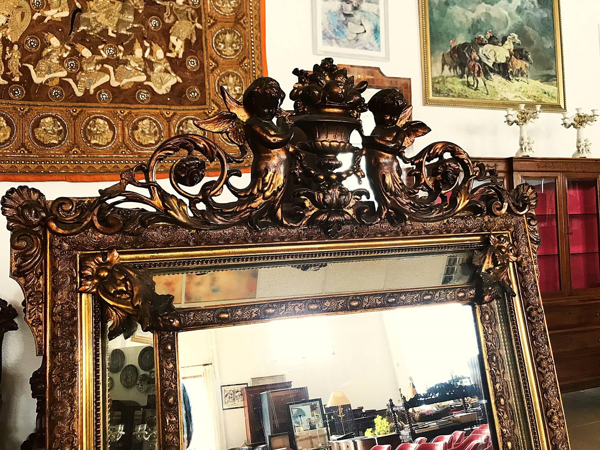 Add French elegance to your home with this antique mirror from Versailles, France. Crafted, circa 1890, the wall mirror is in pristine condition with original gilt finish. This "miroir a parcloses" has a central rectangular mirror with