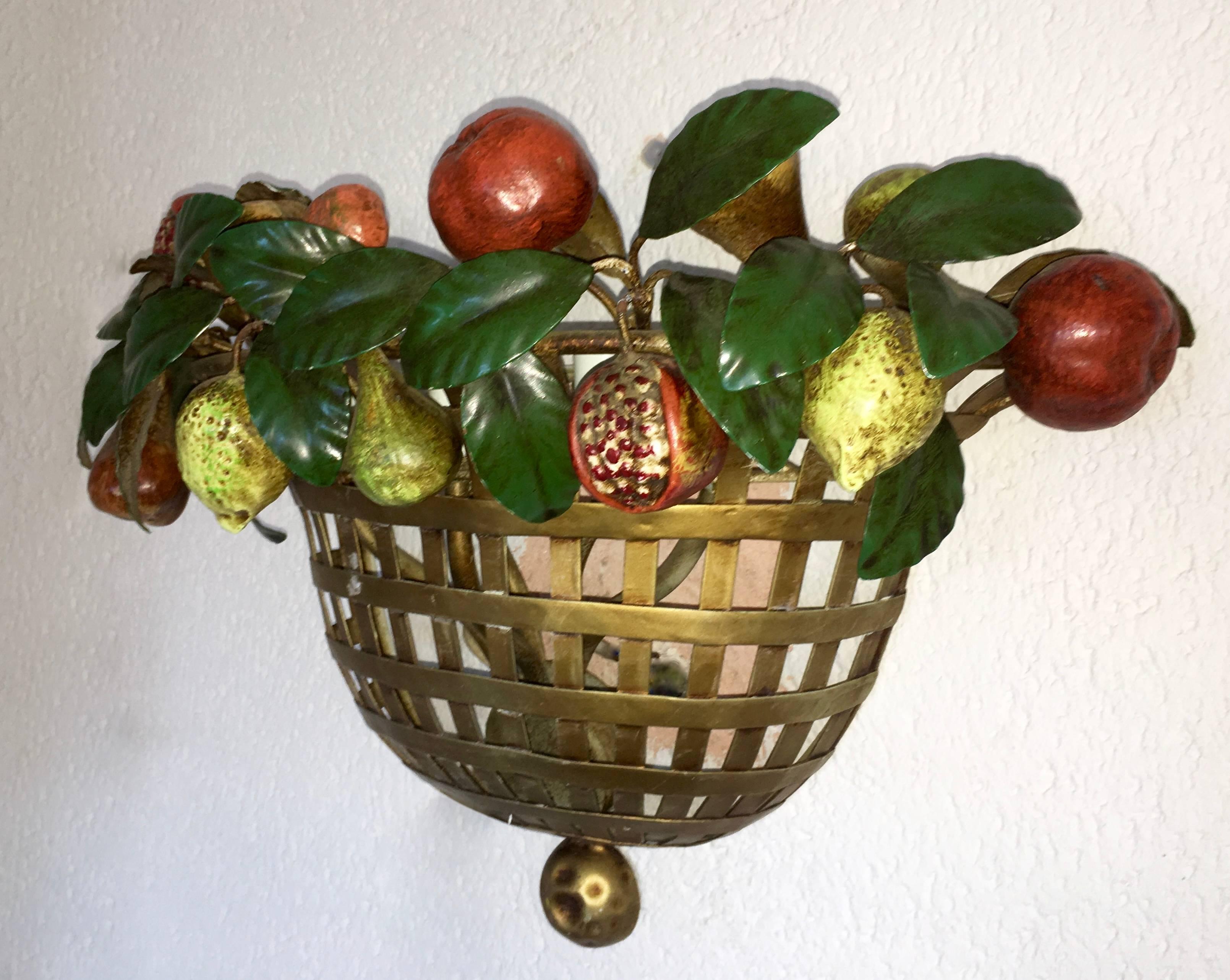 Large gilt on iron five-bulb wall sconce.
Gold basket with hand-painted Mediterranean fruits, pomegranate, lemons, pears and figs
Lucienne Monique Schmitt was an artist with a great passion for beauty in all its forms, born from a French mother