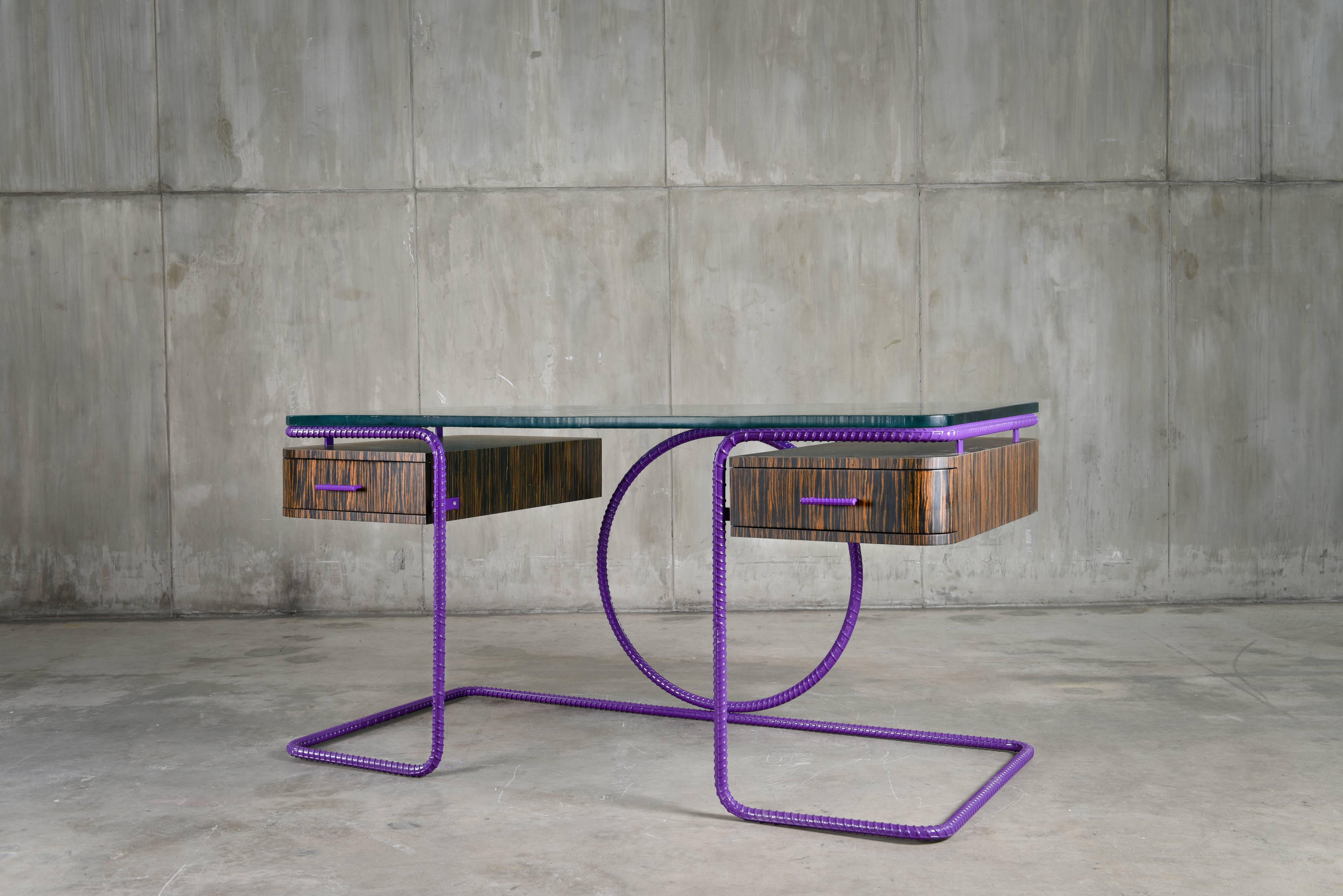 The Cleopatra Writing Desk is part of the Rebar series created by artist Troy Smith. 

Rebar is the steel used in the forming of concrete to give it strength. The rebar is heated with acetylene torches and red-hot forges. Skillfully sculpted by hand