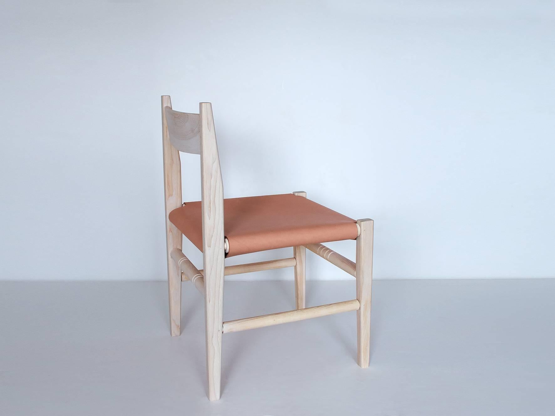 The silo dining chair is available with a carved wooden seat, a woven hickory bark seat, or a leather sling seat. Each chair features a unique pattern on the turned rungs - no two chairs are alike.

Available in black walnut (natural or oxidized),