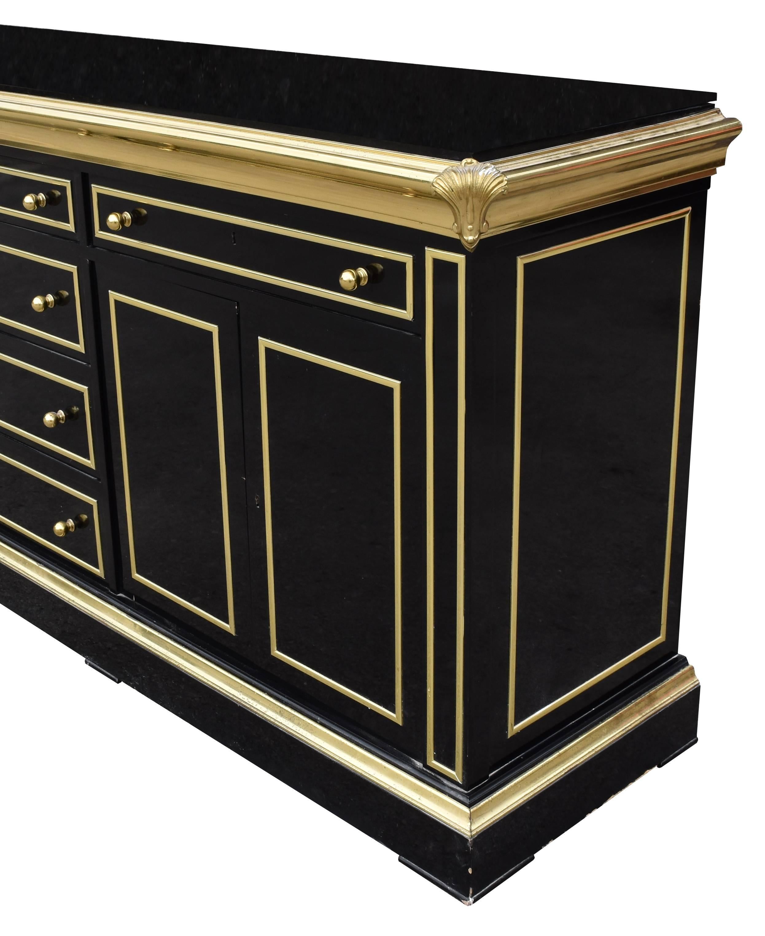 1980s lacquered black sideboard with bronze decorations.
 