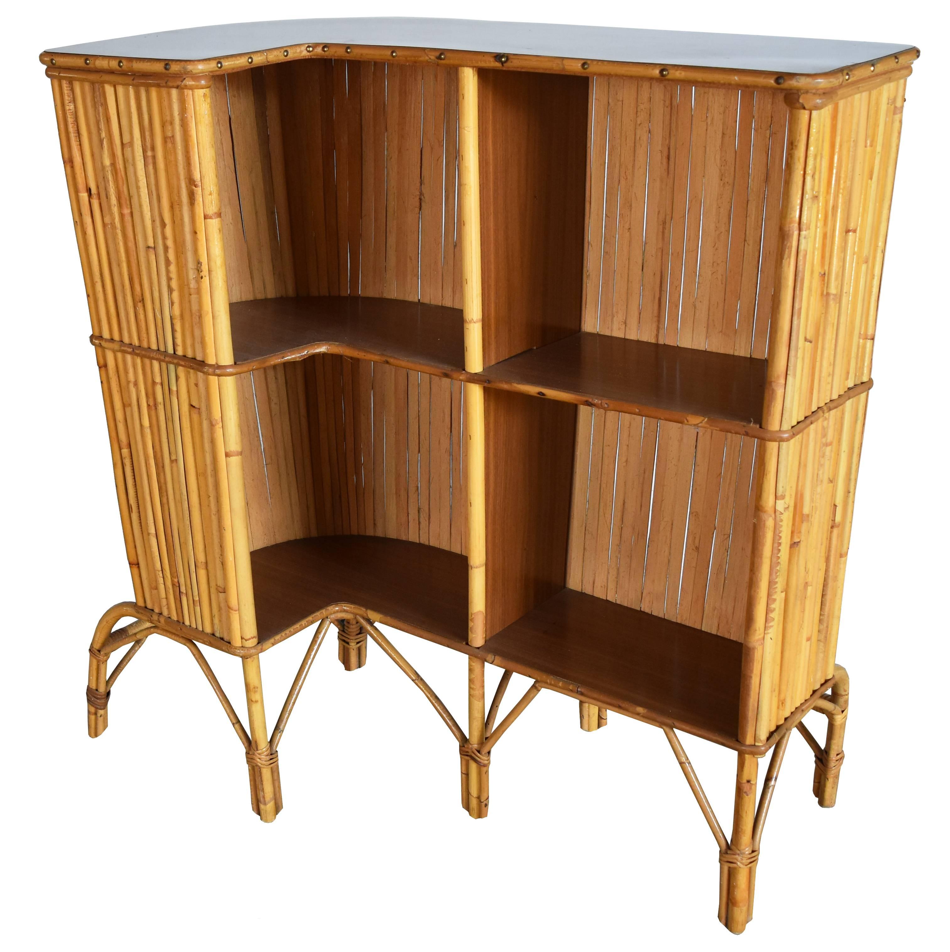 L-shaped mini bar finished with a wooden black lacquered top. Bamboo arched legs and front vertical decorations. In pristine condition.

