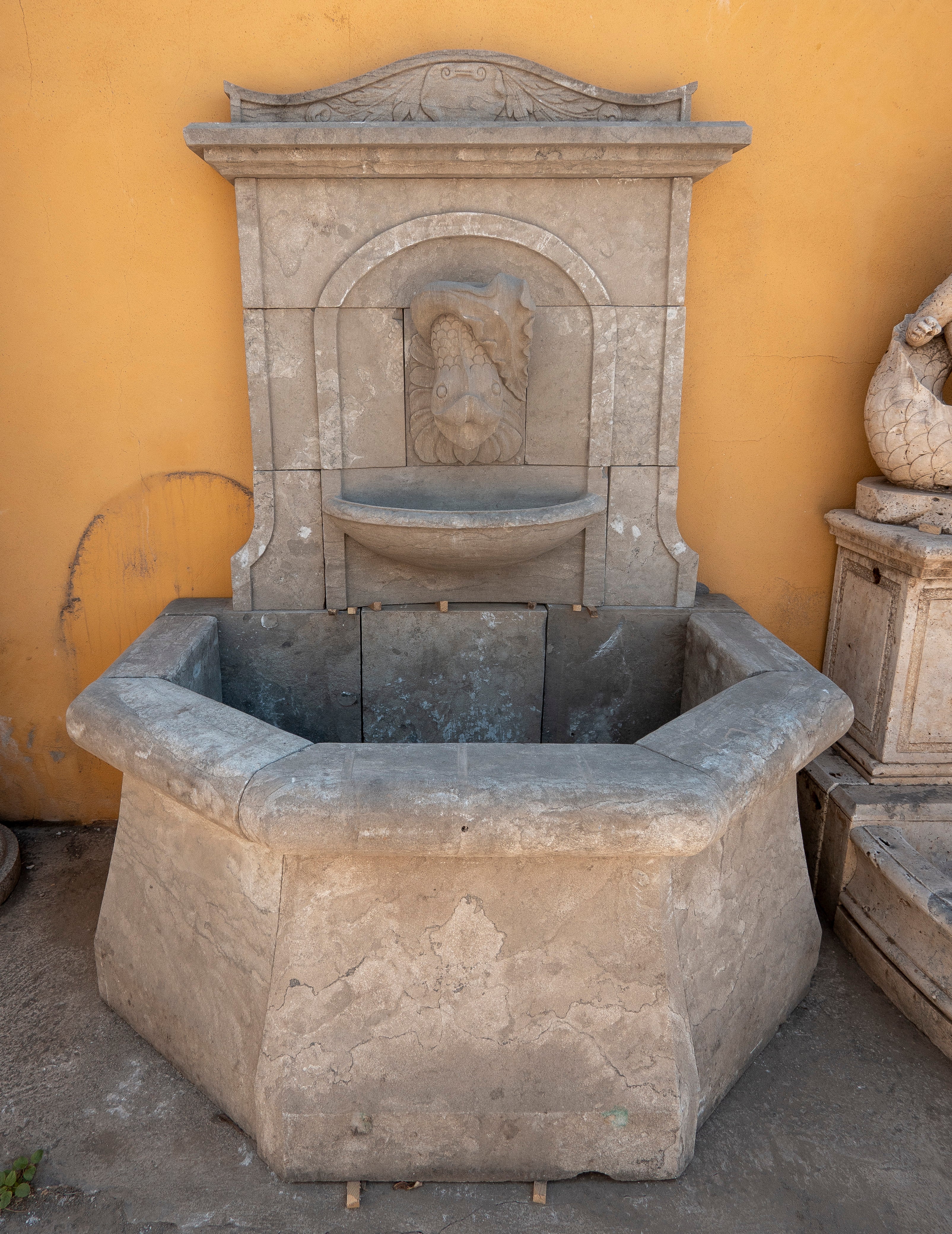 Classical Style Wall Fountain with an Octagonal Basin in Carved Marble. For Sale