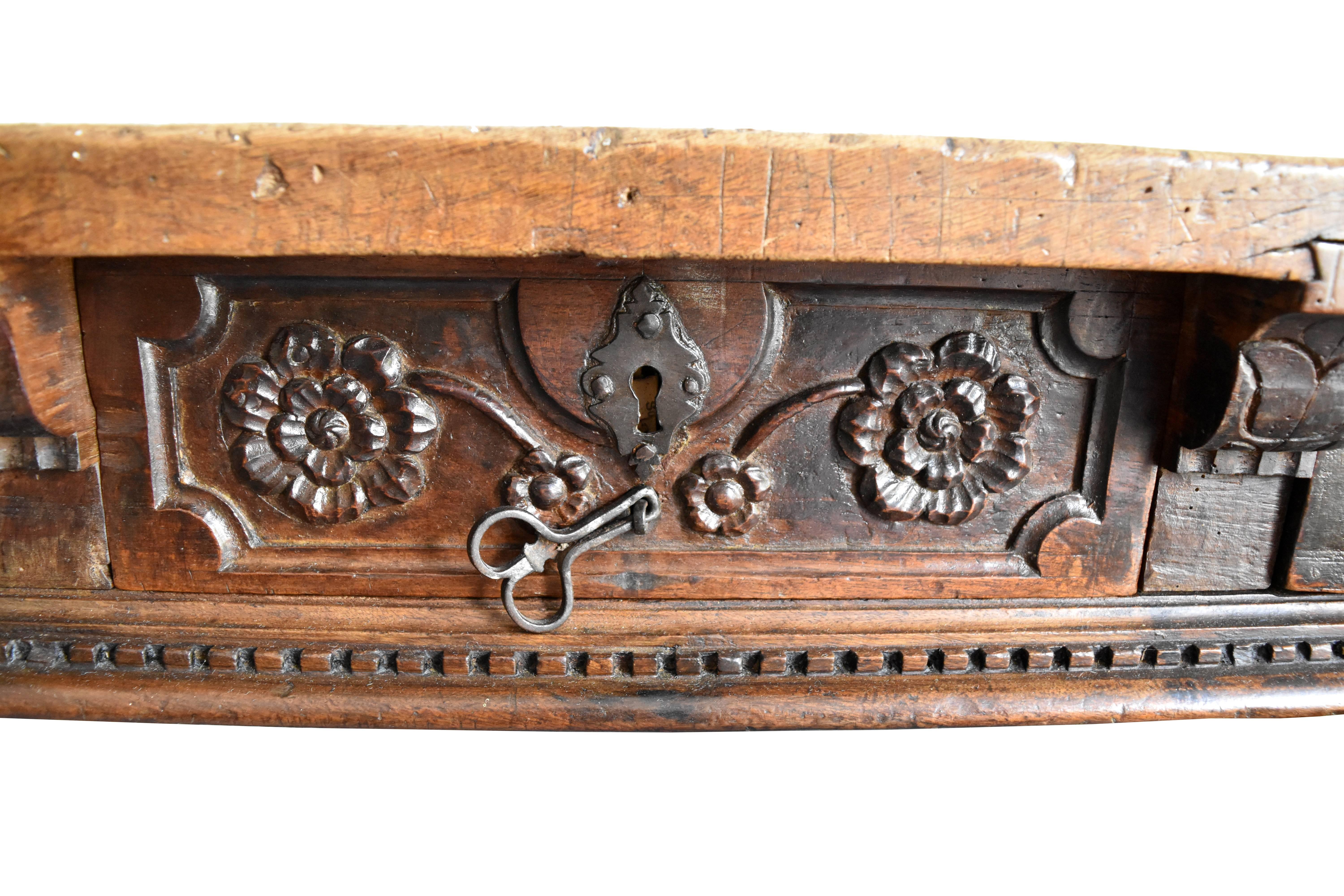 Drawers with floral carvings and original iron handles. Lathed table legs. Not restored, original patina and overall pristine condition.
 