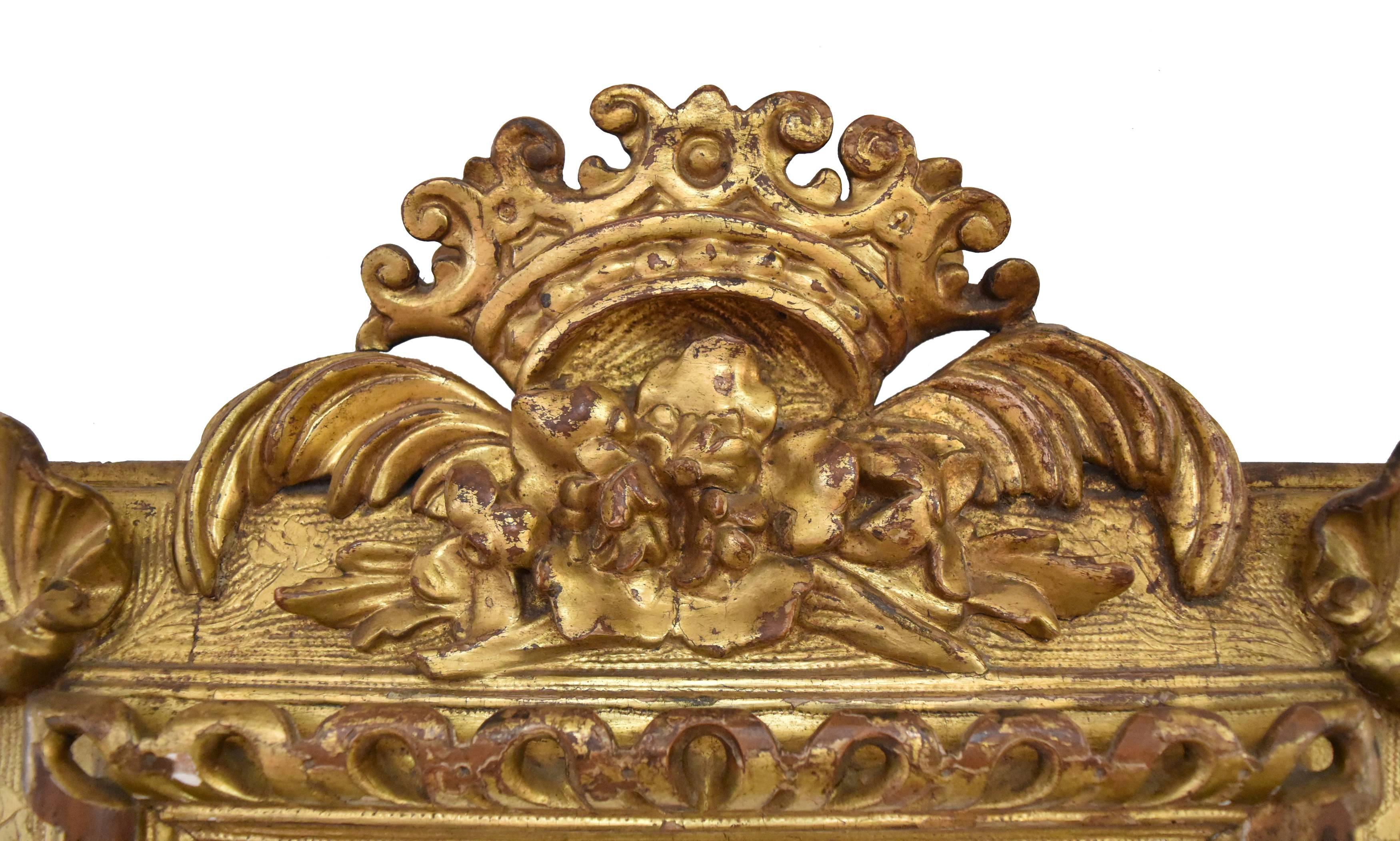 Fabulous pair of mirrors hand-carved, with details of shells, flowers and crown on the top.