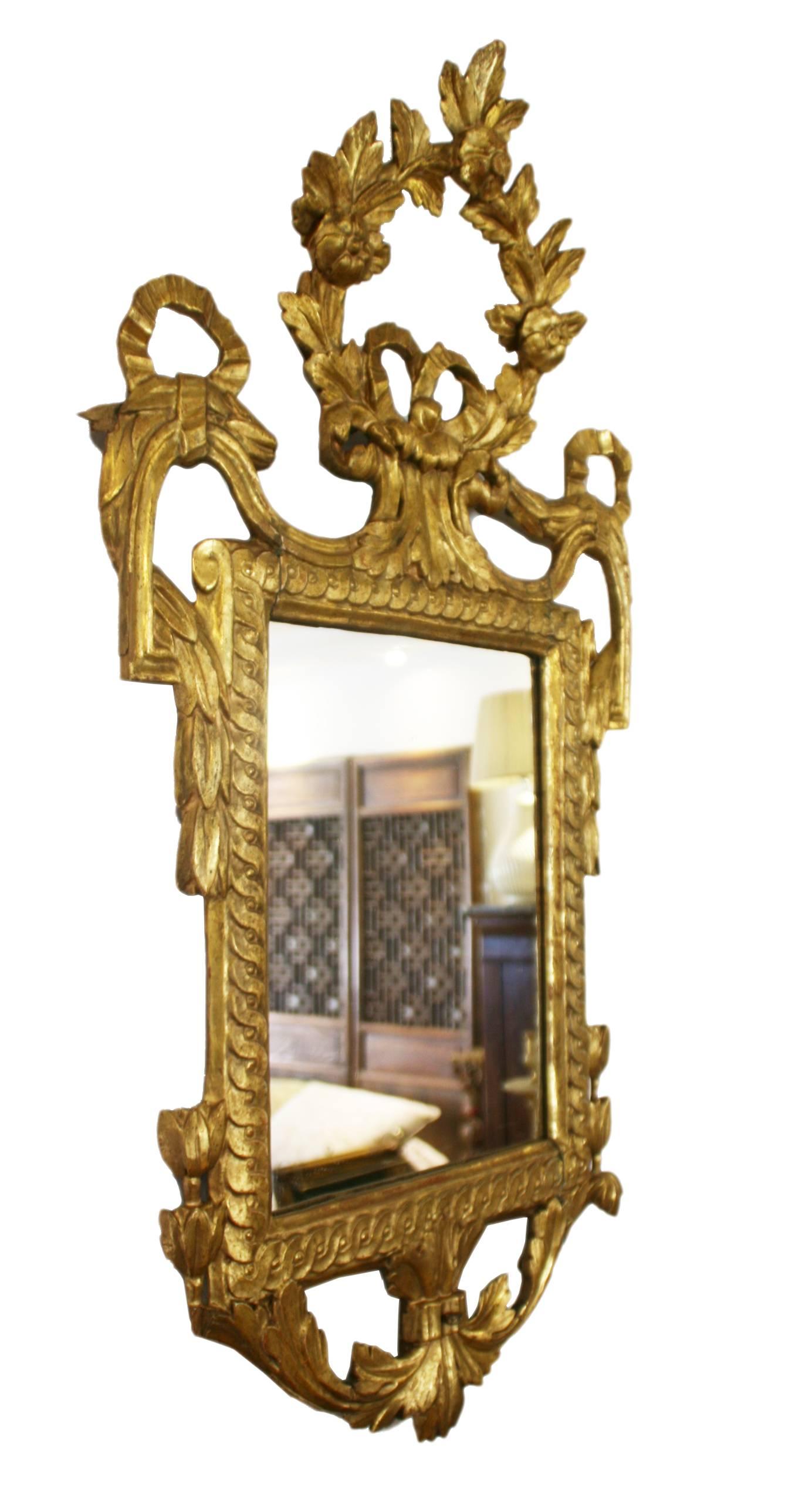 Spanish origin neoclassical style carved gold gilded wooden frame, surrounded and topped by vegetable decorations and laces.

  