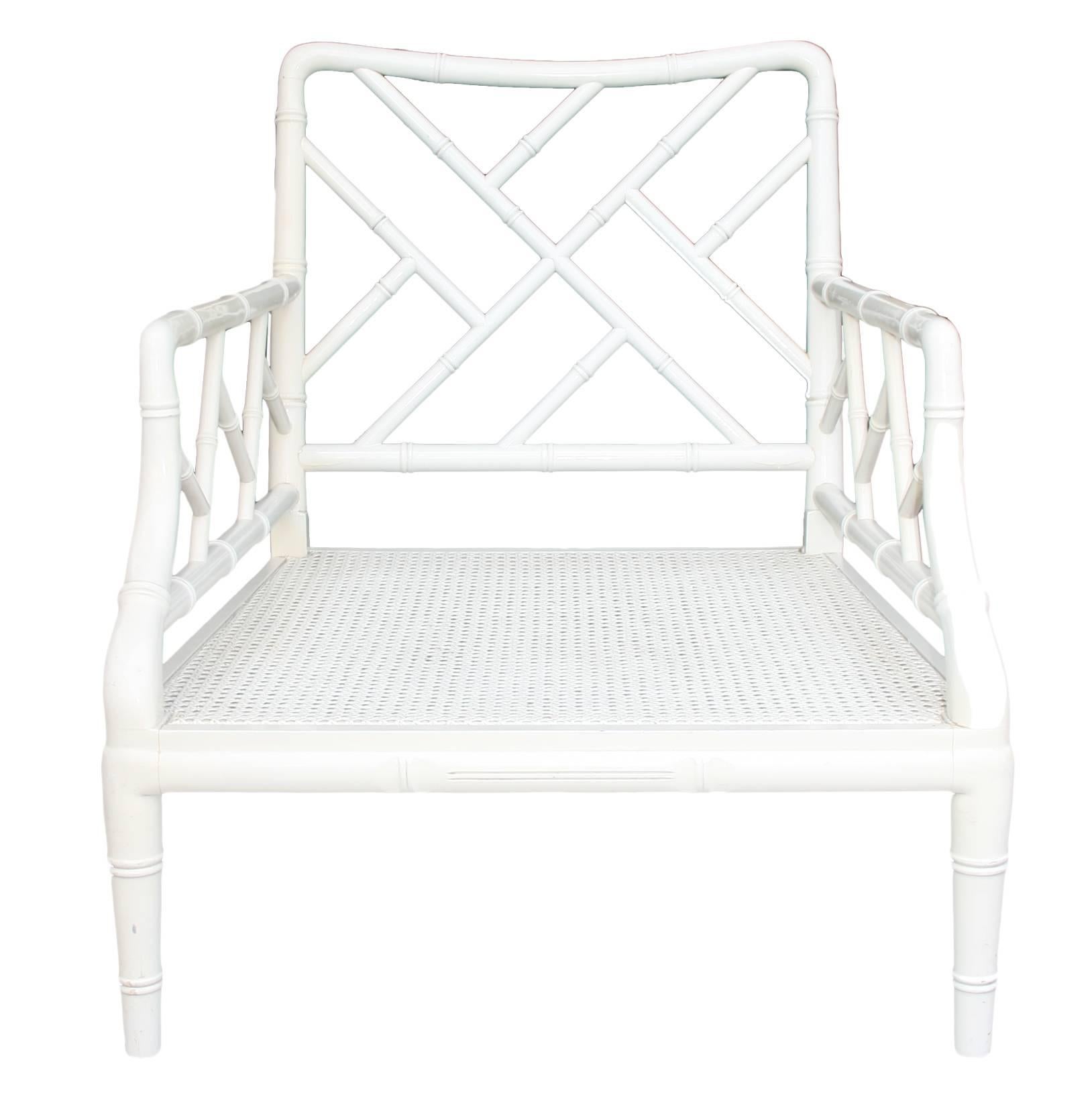 White lacquered wooden sofa chairs hand-carved to imitate bamboo.
 