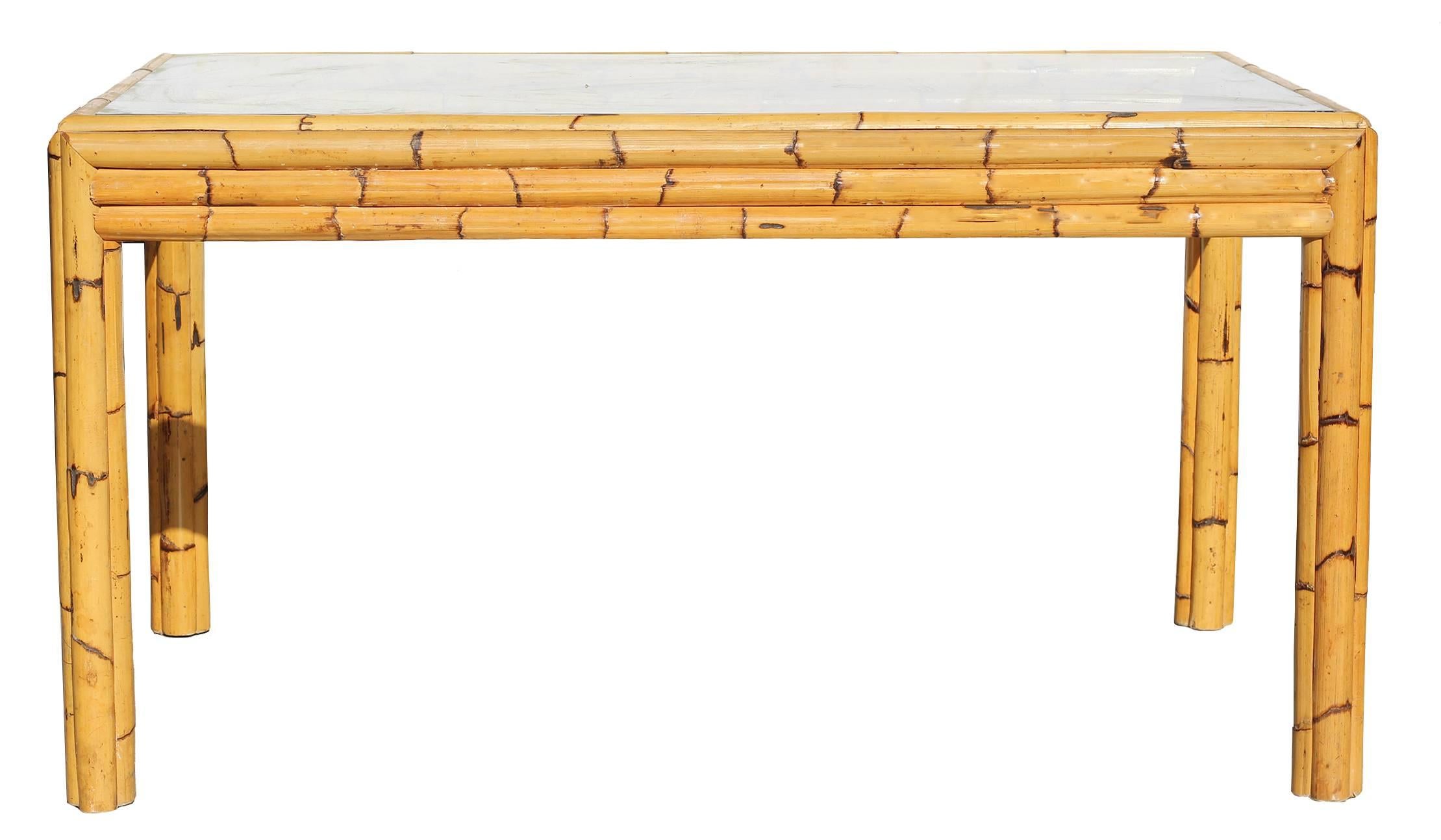 Thick and strong bamboo stalks give ample support for a dark smoked glass table top. 