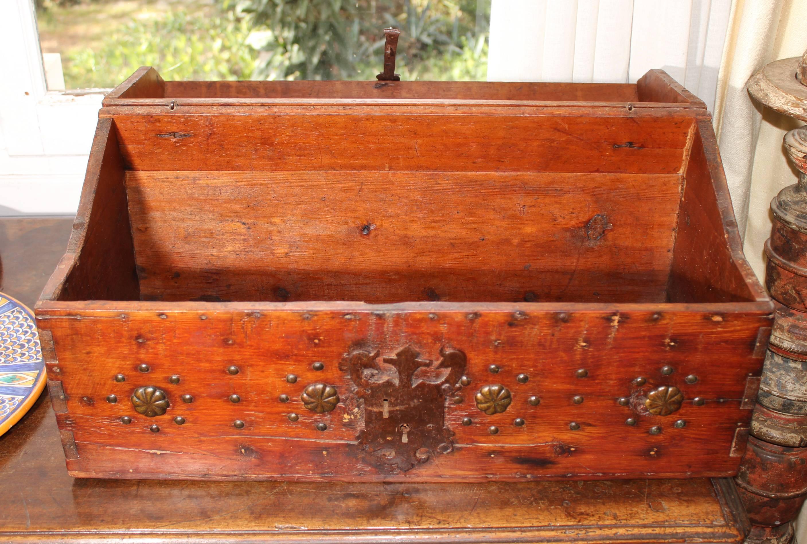 18th century pine wood chest with original forged iron ornamental motifs.