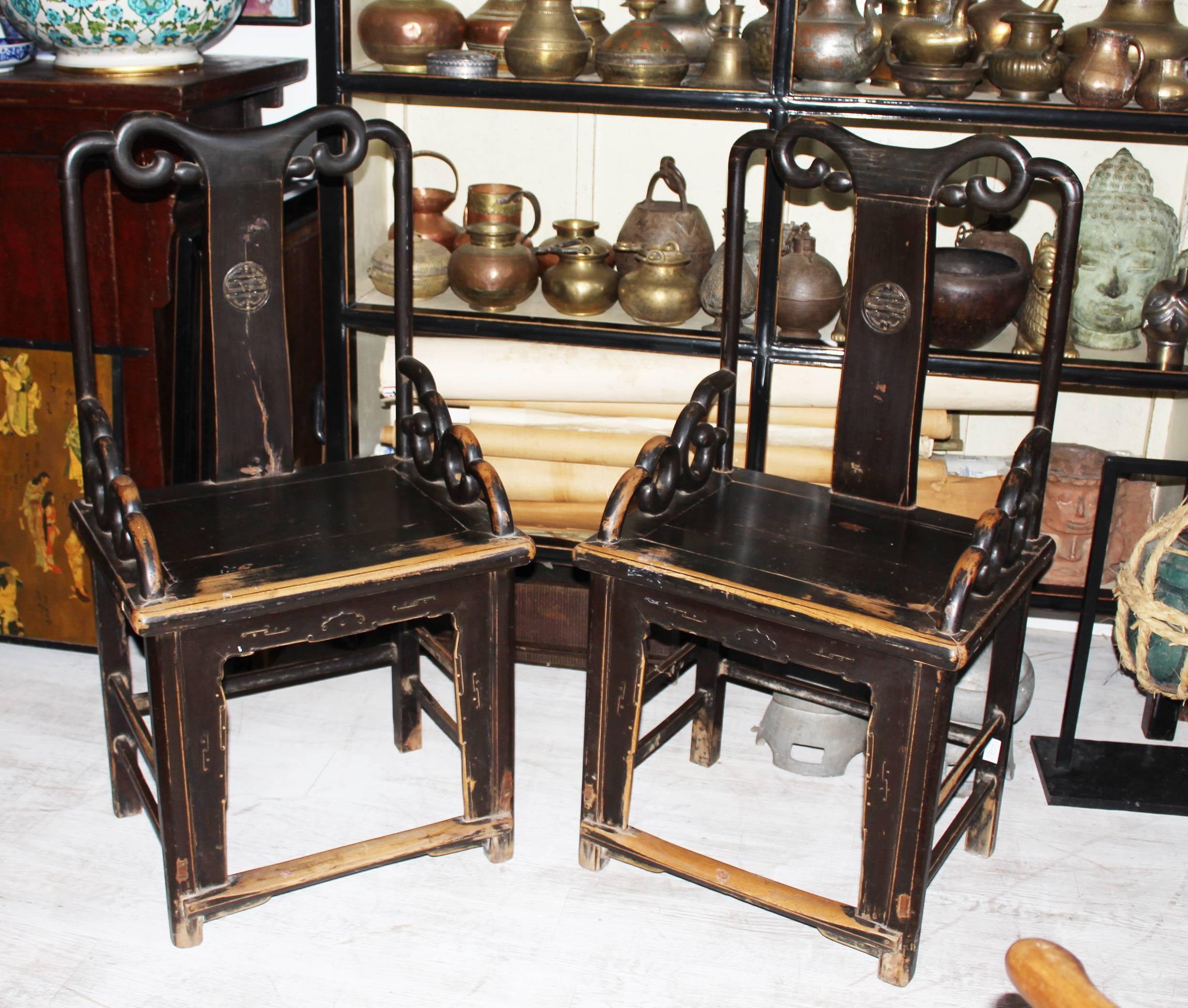 Elegant pair of 19th century chinese wooden hand carved chairs with open backrest.
