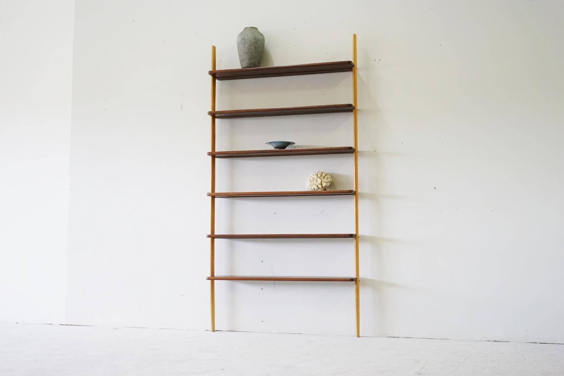 Rare midcentury teak wall unit shelf system, 1960s
The condition is good, the shelves are straight and the processing is excellent.
The rare shelf is very beautifully built and processed. It fits well into the living and office area.
 