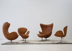 Two Egg Lounge Chairs with Ottoman and Two Swan Armchairs