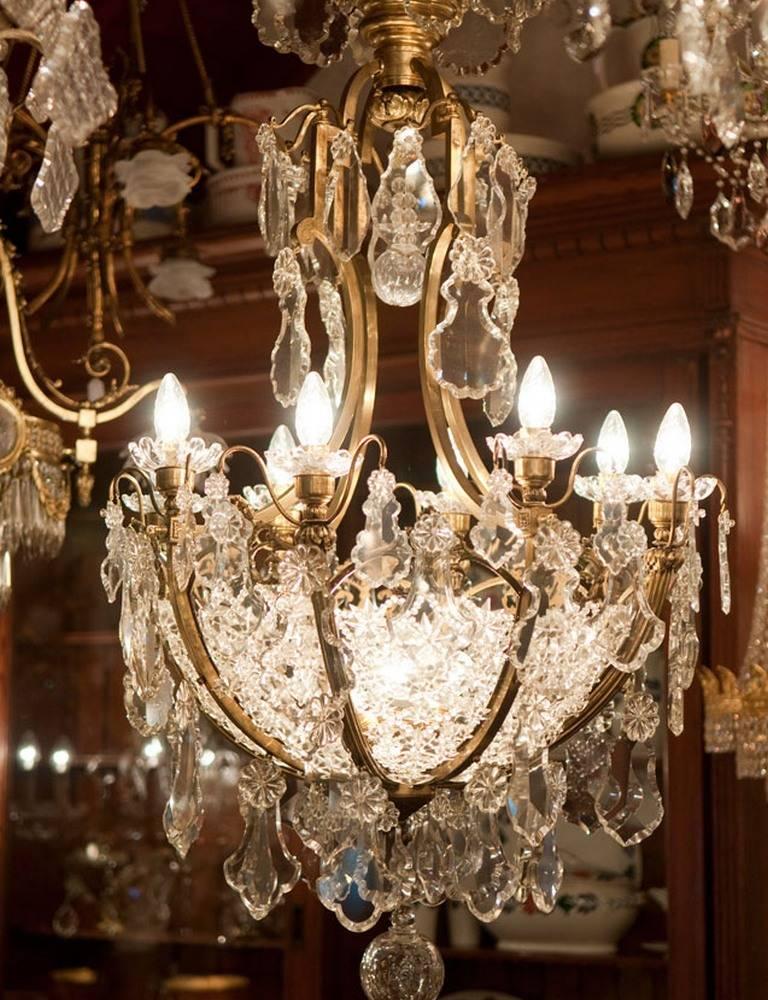 French bronze chandelier. Recently fully restored and rewired. Crystal wicker-work is beautiful restored and therefor in great condition. Eight lights and four lights in the bag. Nice crystals and bobeche cups.
This is just one of the collection of