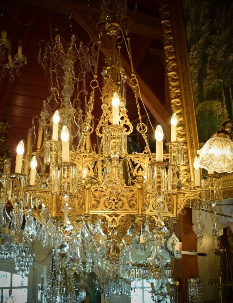 Large bronze chandelier original with candles. Unique piece because the bronze frame is in great condition and very nice decorated with all kinds of detailing. When you want to turn your home into a castle this is the of a kind item. 12-light.
 