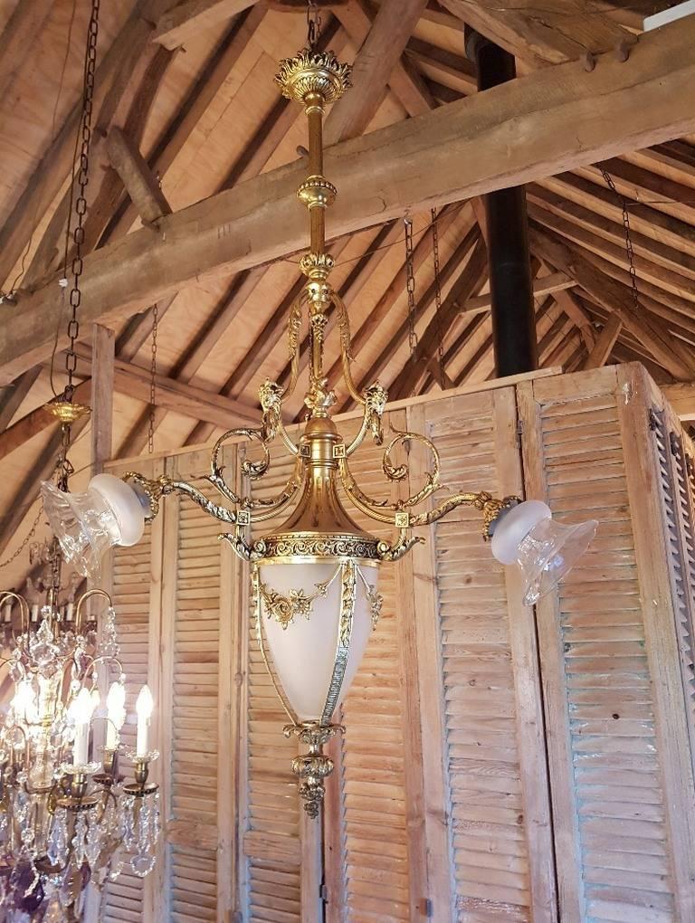 French chandelier bronze with four lights including one large bullet shape globe of frosted glass. Beautiful bronze ornaments and detailing.
This is just one of the collection of 1000 chandeliers, ceiling lamps and wall lightning.