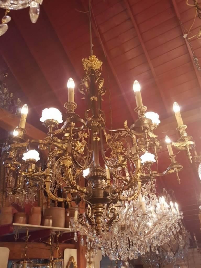 Large French bronze and brass chandelier with 15 lights. Beautiful detailing.

This is just one of our large collection chandeliers. Besides the old and antique chandeliers we have beautiful series of new large chandeliers in the Marie Therese
